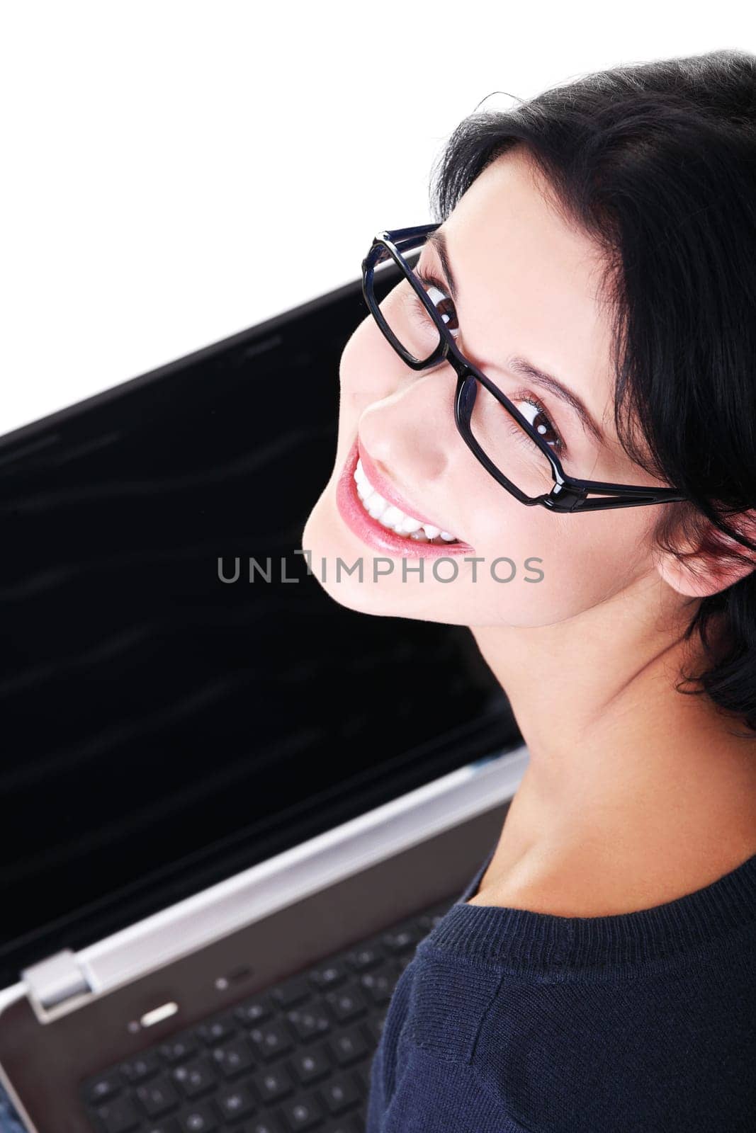 Happy young woman using her laptop, isolated on white.
