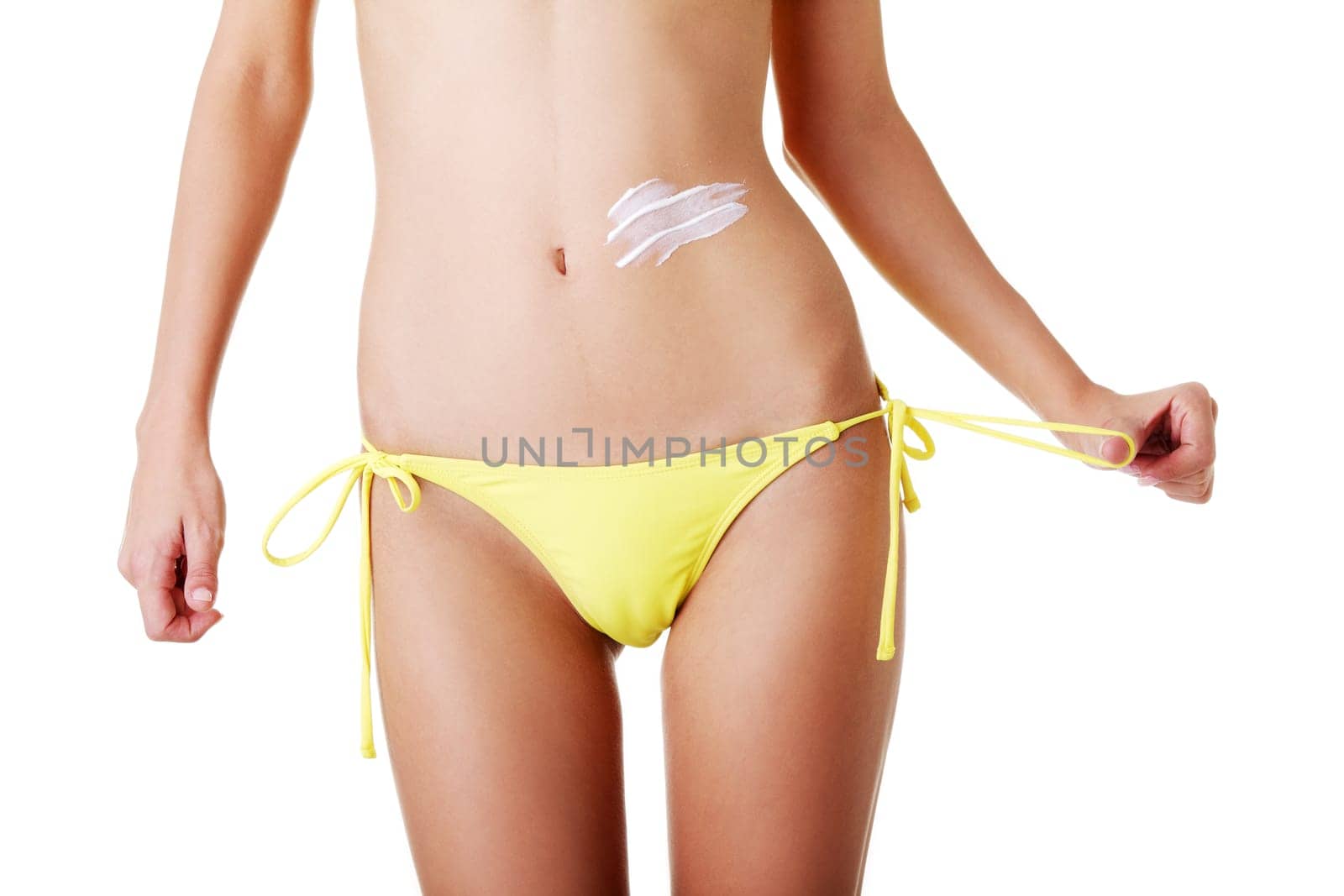 Sexy summeg girl belly with cream, isolated on white