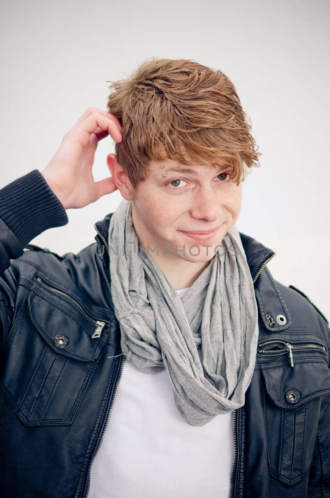 Real young man on simple background