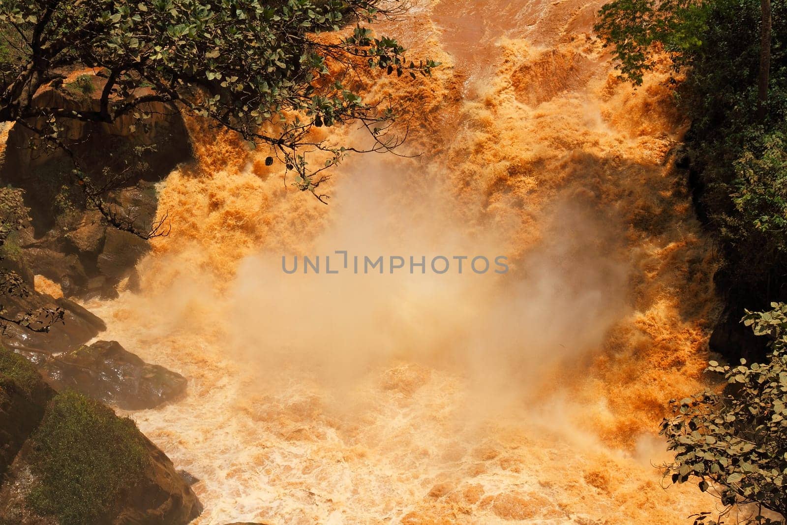 An extremely muddy waterfall found at the border between Tanzania and Rwanda.