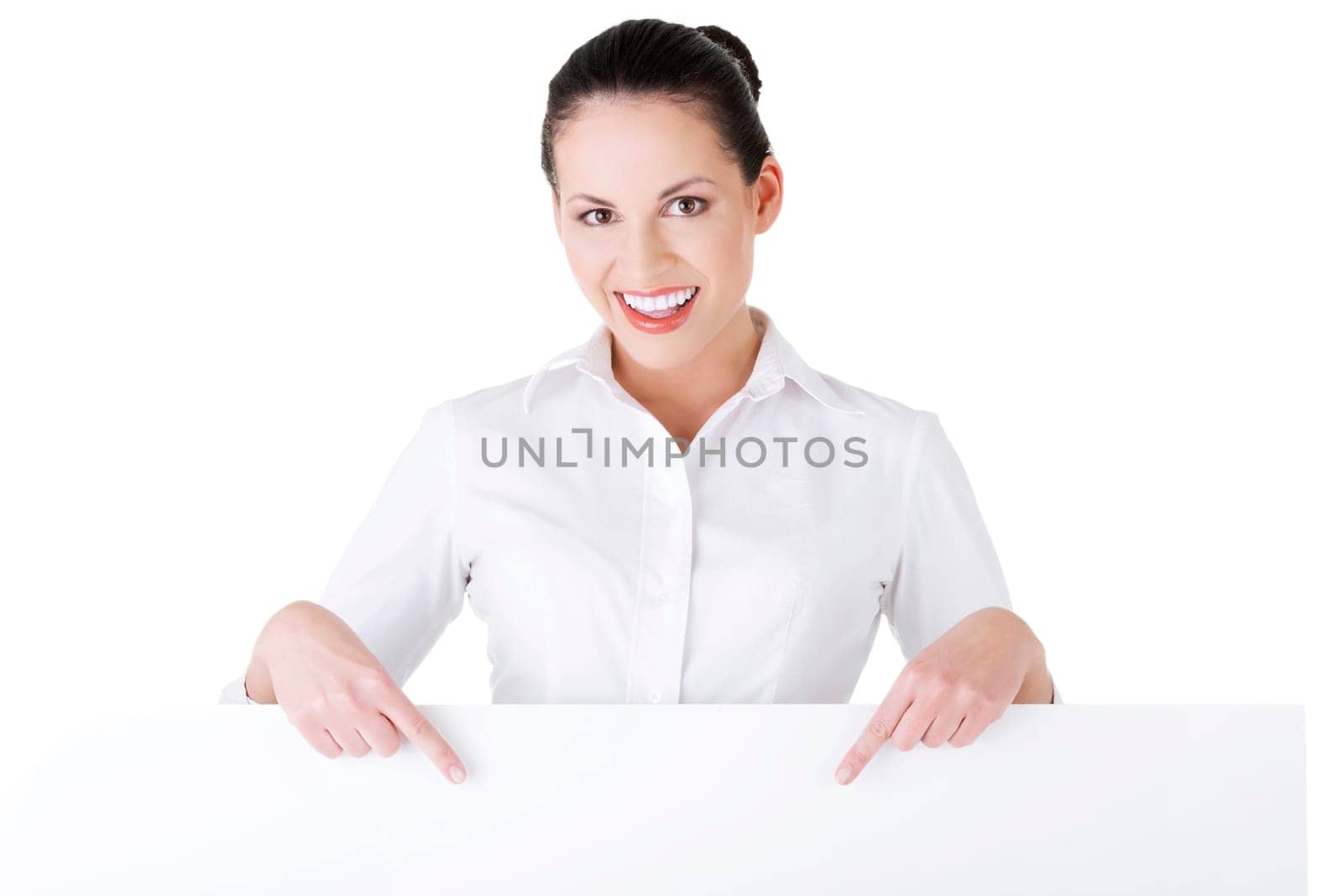 Smiling young business woman showing blank signboard, over white background isolated