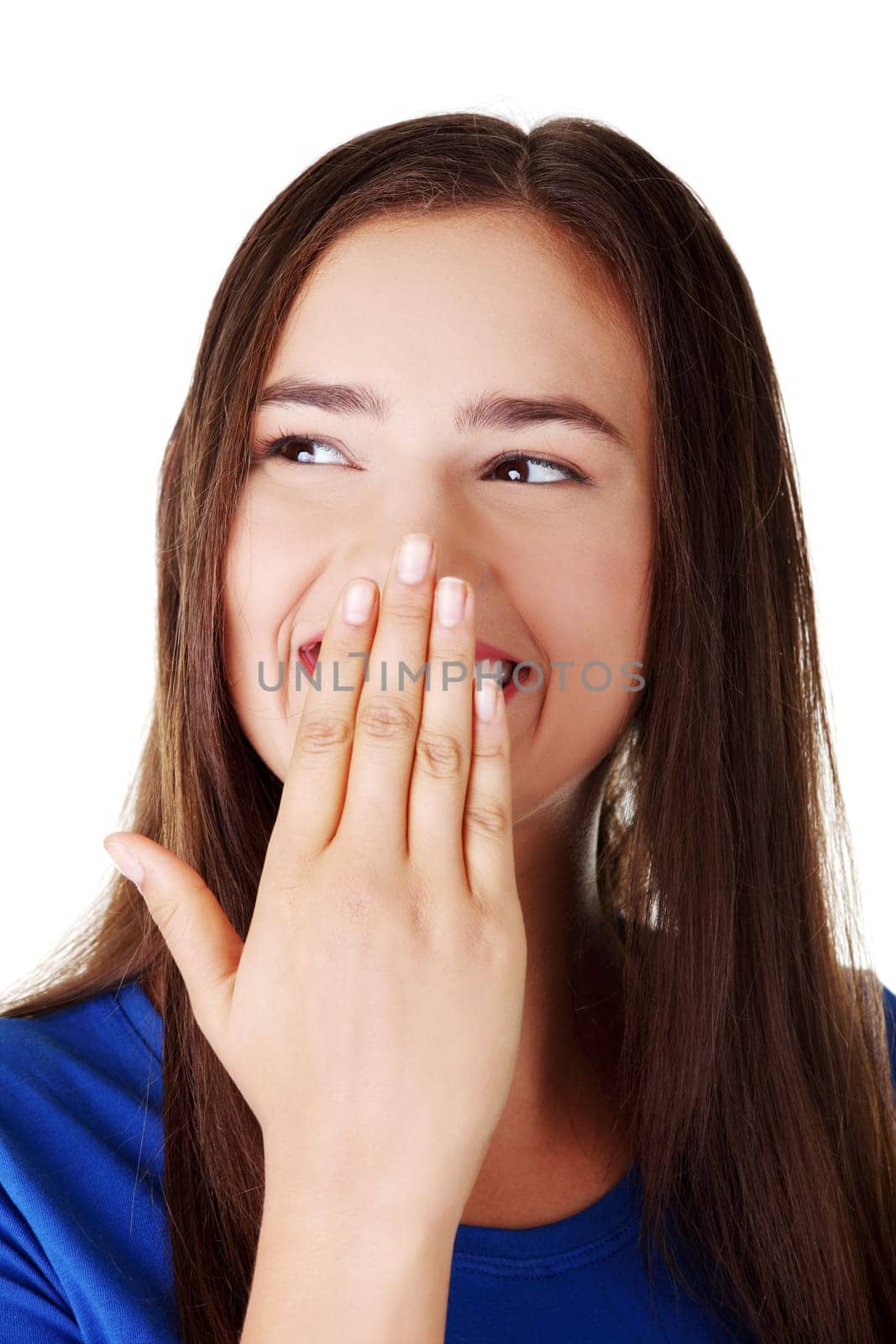 Woman covering mouth with hand,