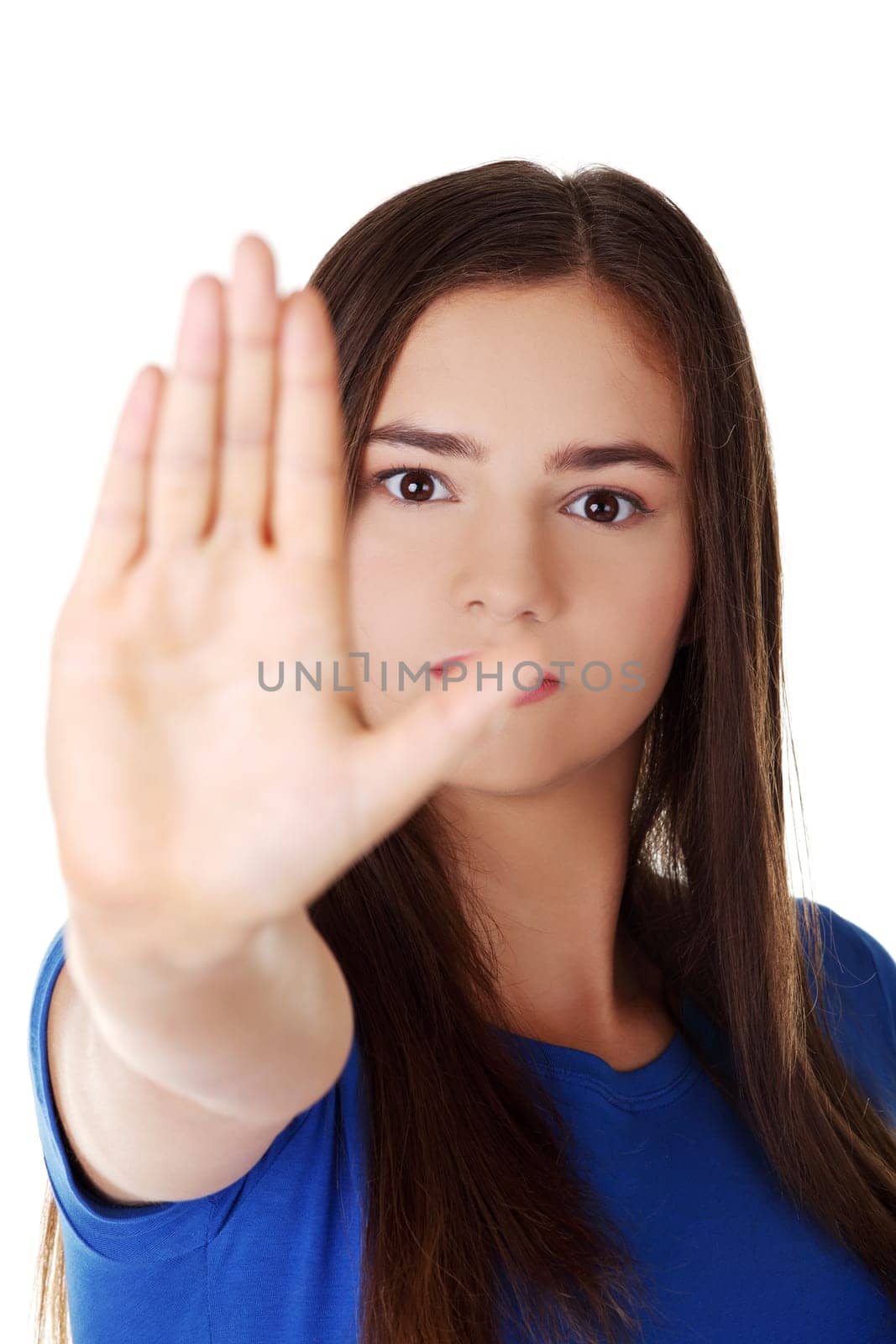 Confident woman making stop gesture sing with hand