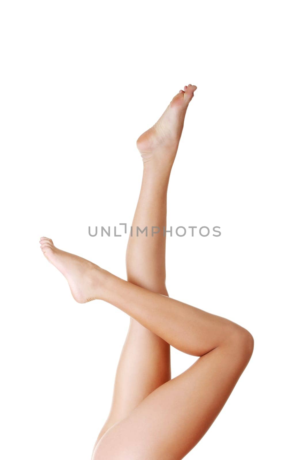 Beautiful fit long female legs, isolated on white