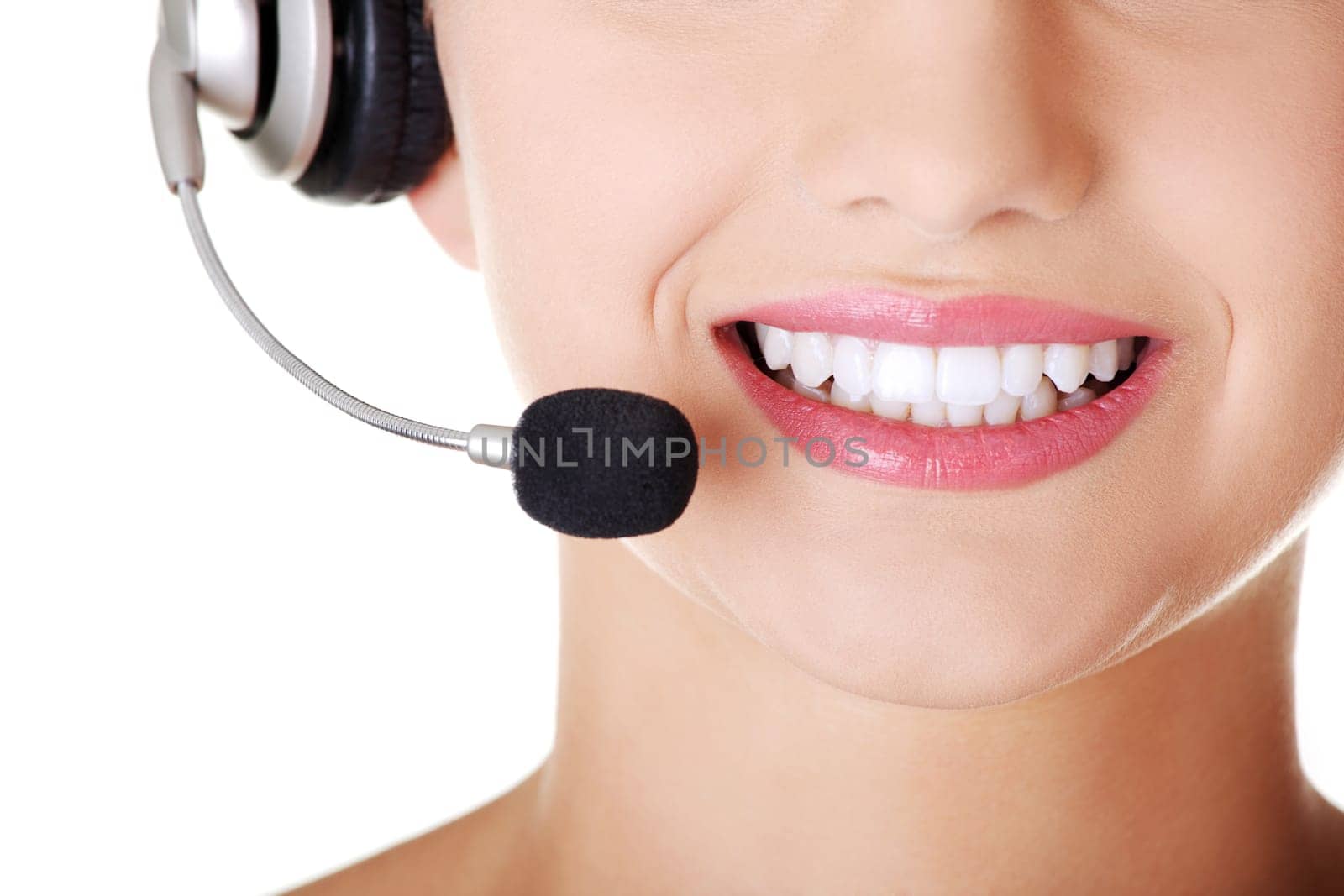 Beautiful young call-center assistant smiling , isolated