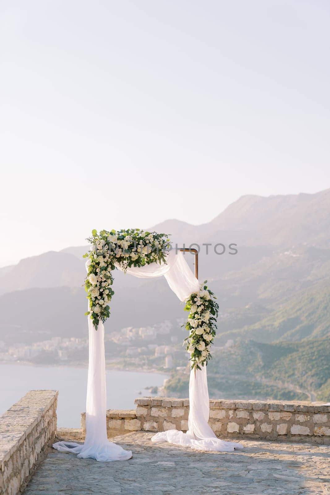 Wedding arch stands on an observation deck in the mountains. High quality photo