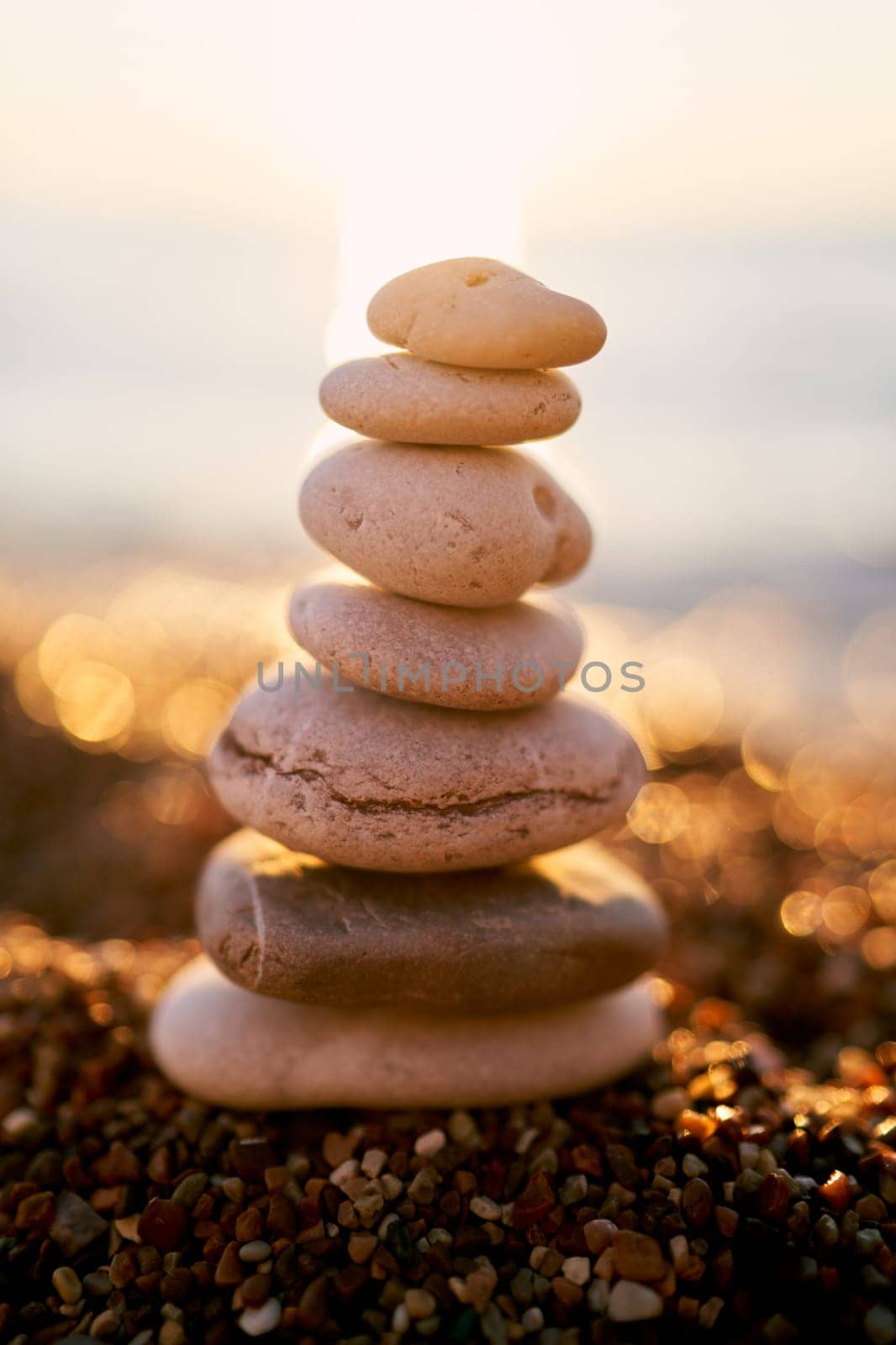 Cairn lies on the seashore in bright sunshine. High quality photo