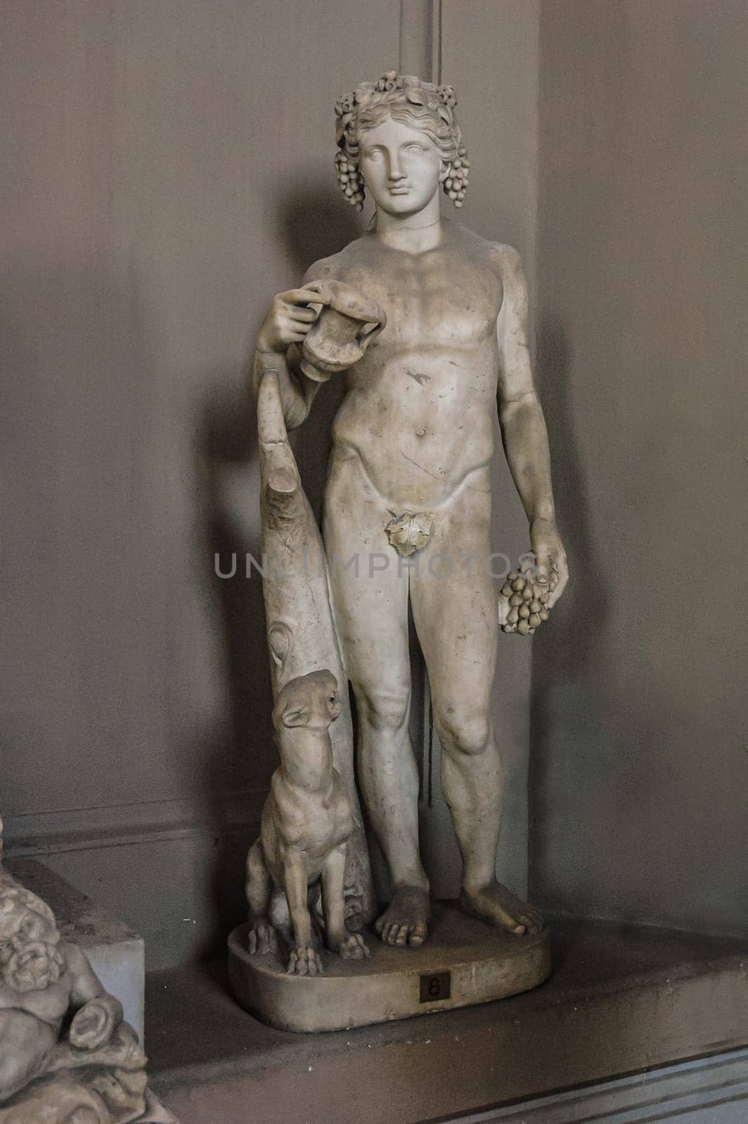 Vatican City, August 21, 2008: Statue of the God Bacchus. Pio Clementino Museum, St. Peter's Basilica