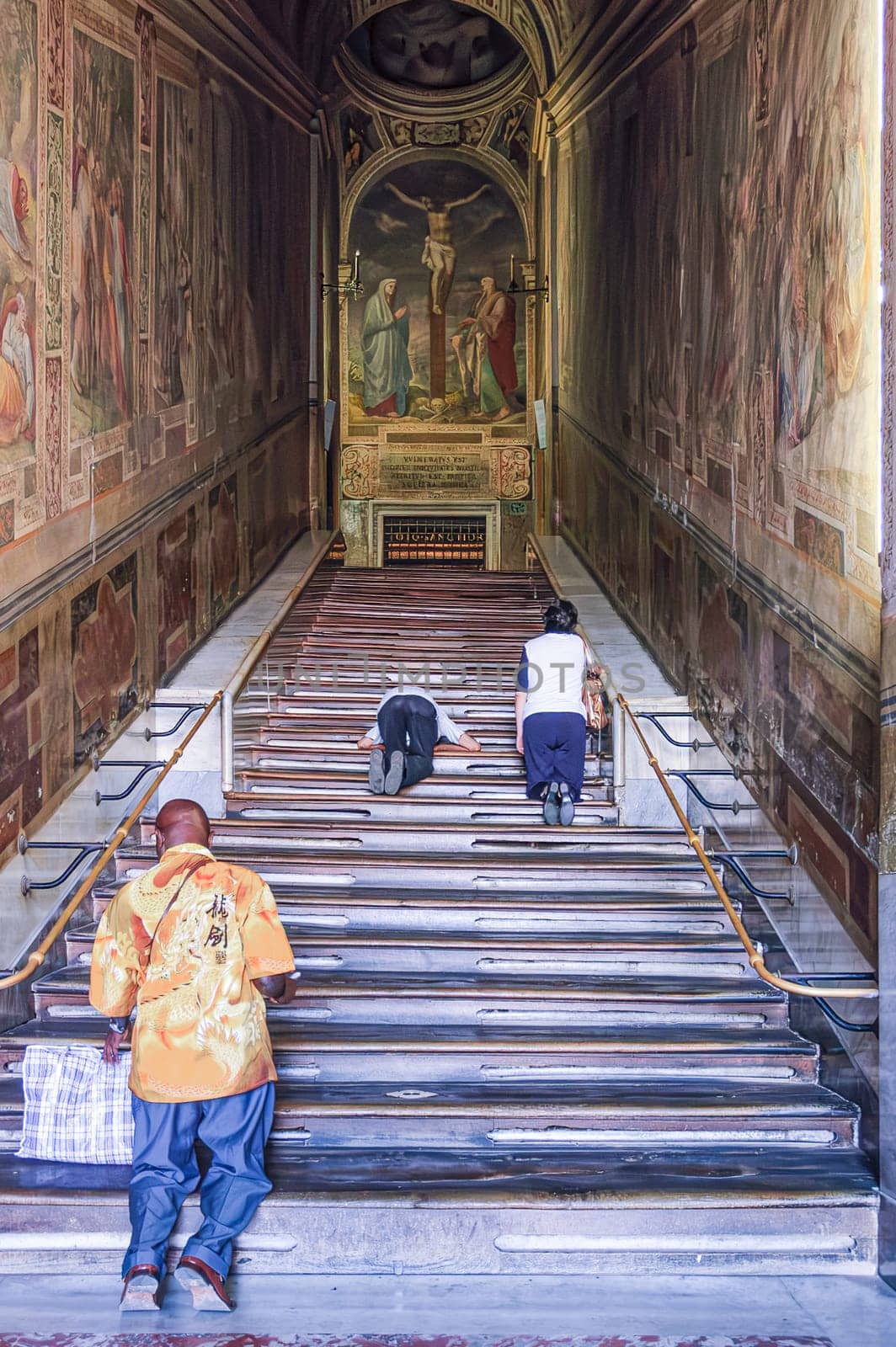 Rome, Italy, August 23, 2008: Faithful kneeling up the Scala Santa to access the Sancta Sanctorum.