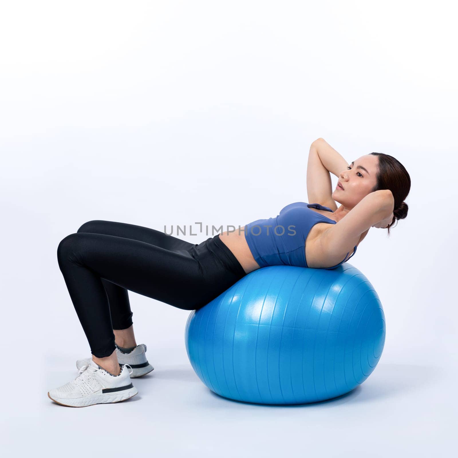 Young attractive asian woman portrait in sportswear with fit ball. Vigorous by biancoblue