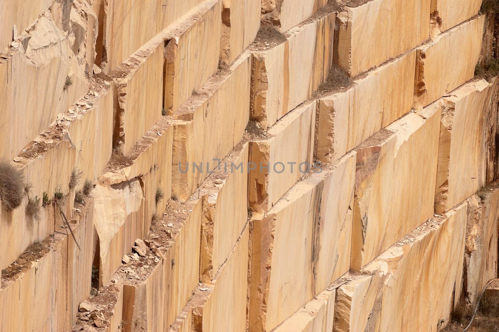 Wall of a marble quarry with marks left after extraction of the blocks, Alentejo, Portugal