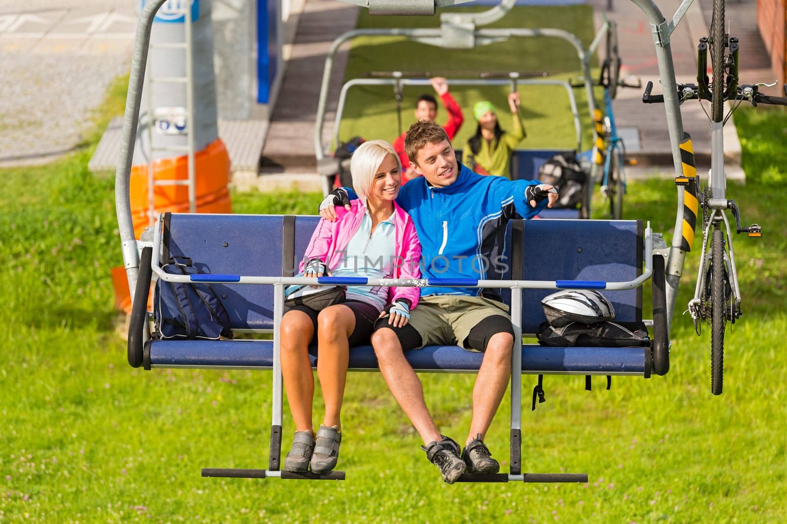 Couple on chair lift enjoying landscape