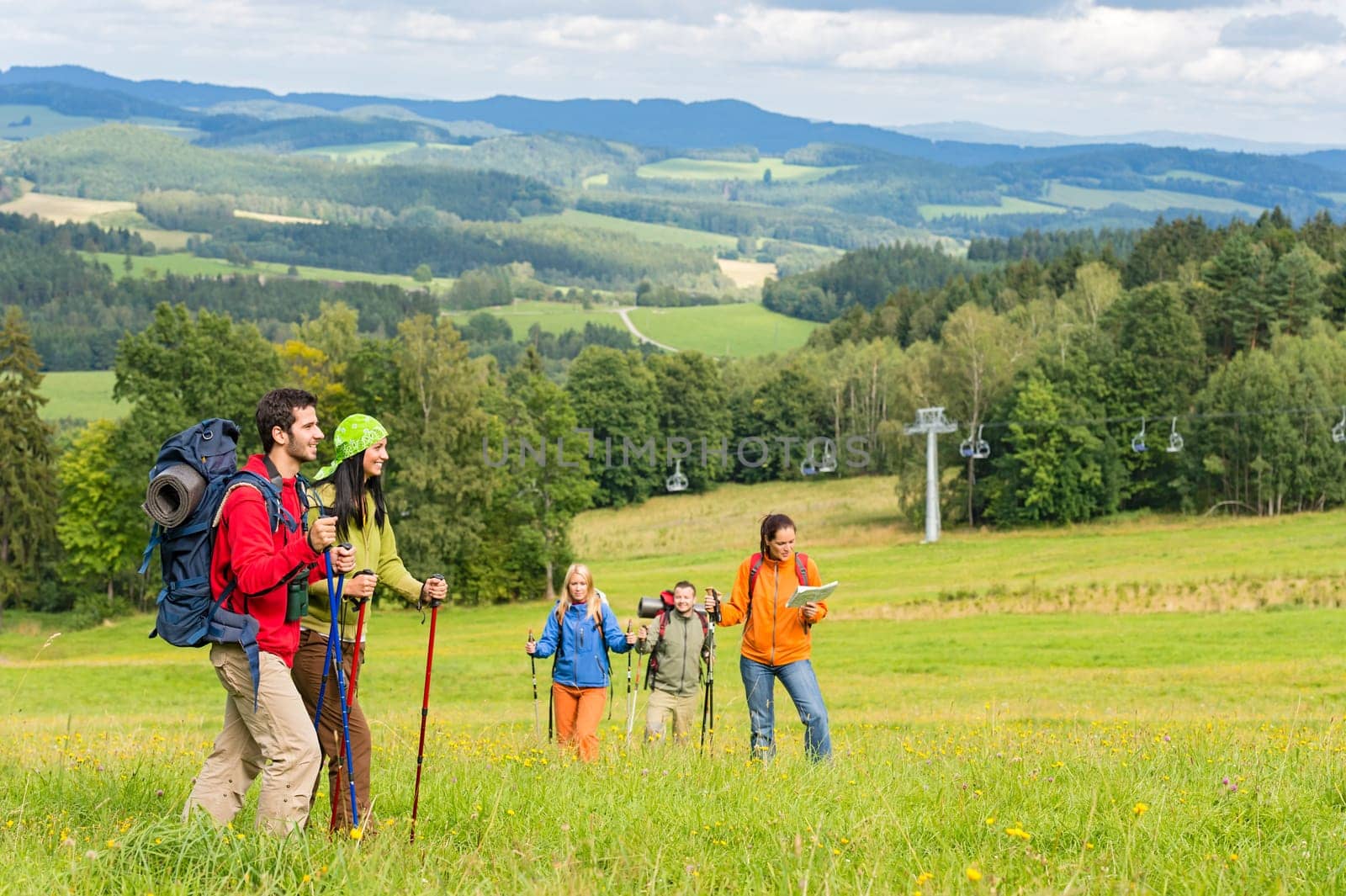Young trekking people enjoying nature and scenic landscape