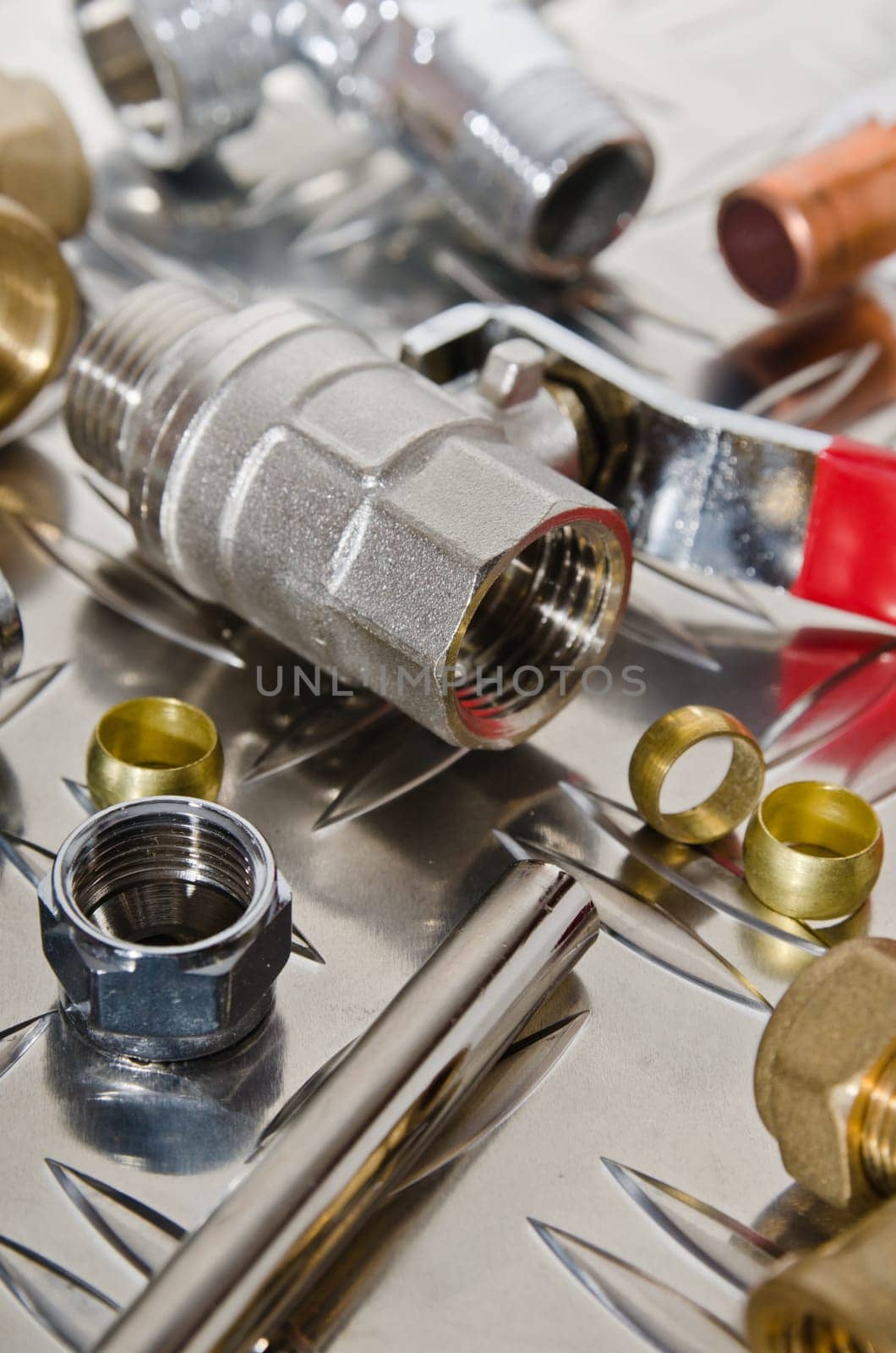 Plumbing inlet pipe valve on a metal surface