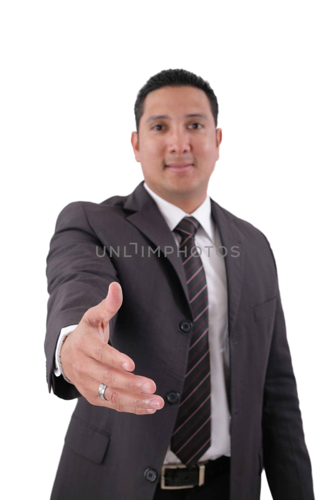 A business man with an open hand ready to seal a deal.  Focus in the hand.