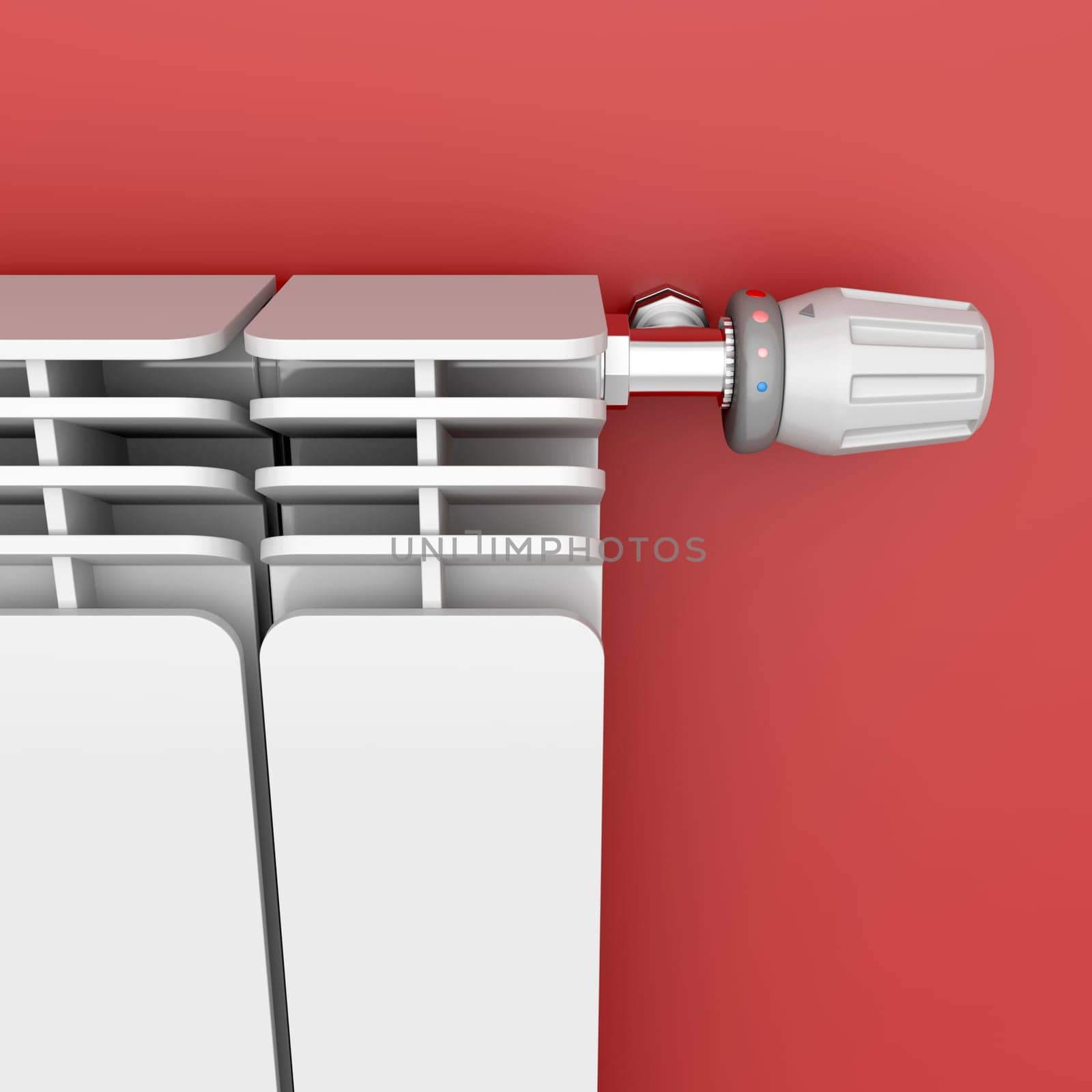 Heating radiator with thermostat attached on red wall