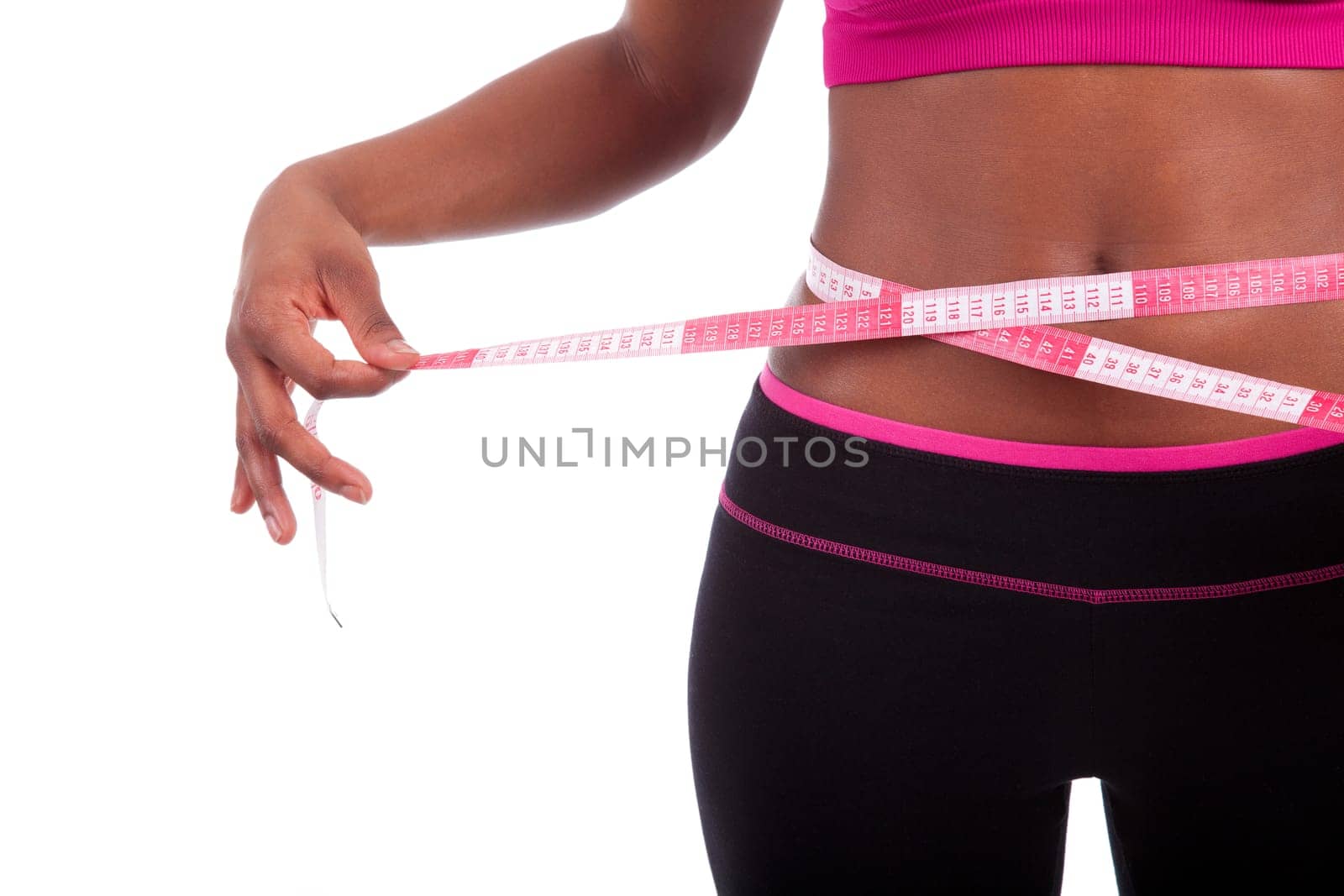 African American Fitness woman measuring her belly, isolated on white background