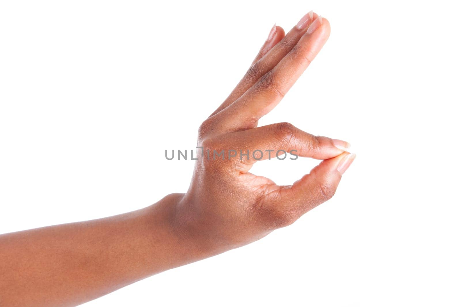 Closeup of woman's hand gesturing - showing ok sign, isolated on white background