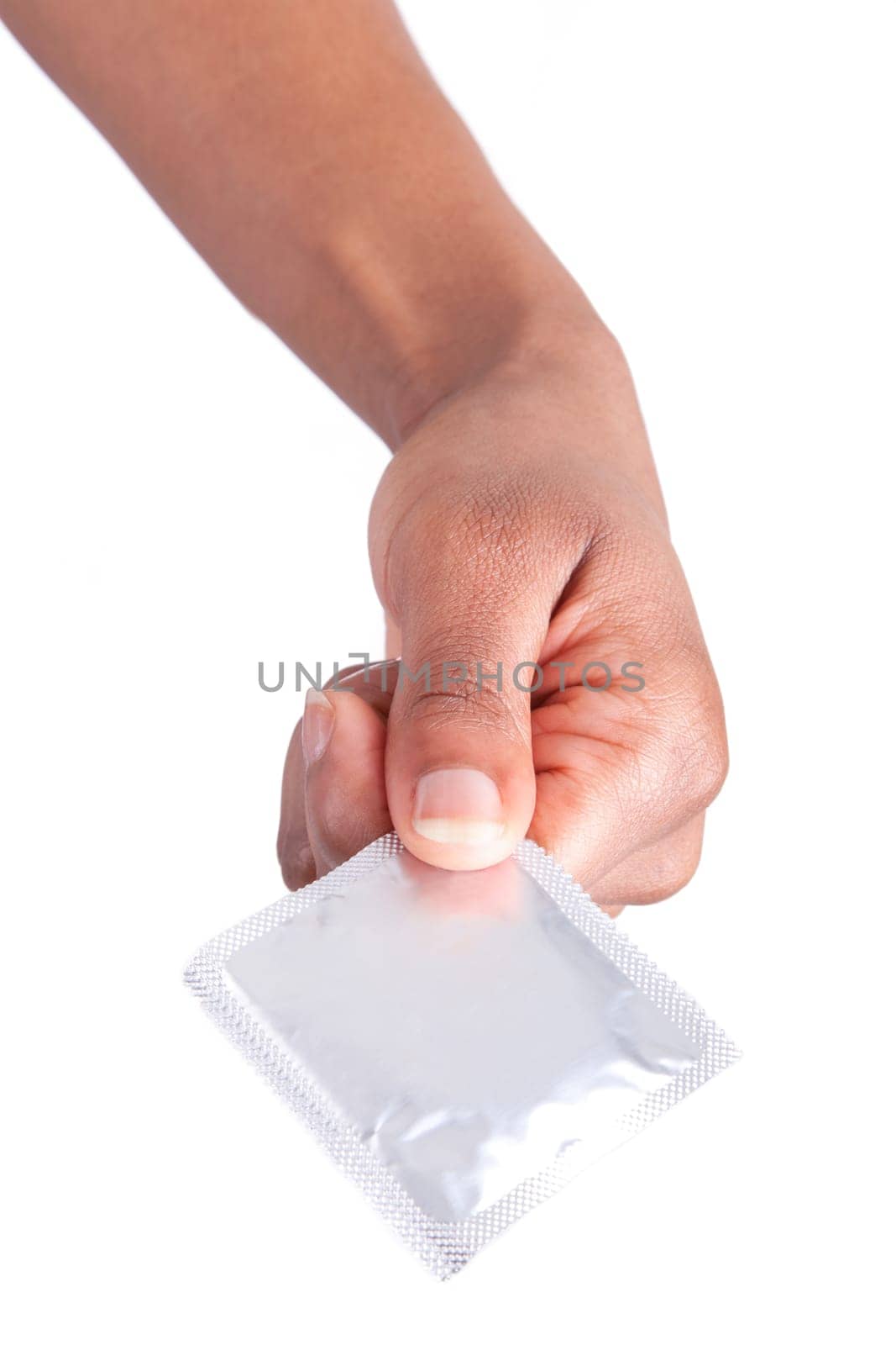 Safe sex concept. African woman Hand with condom, isolated on white background