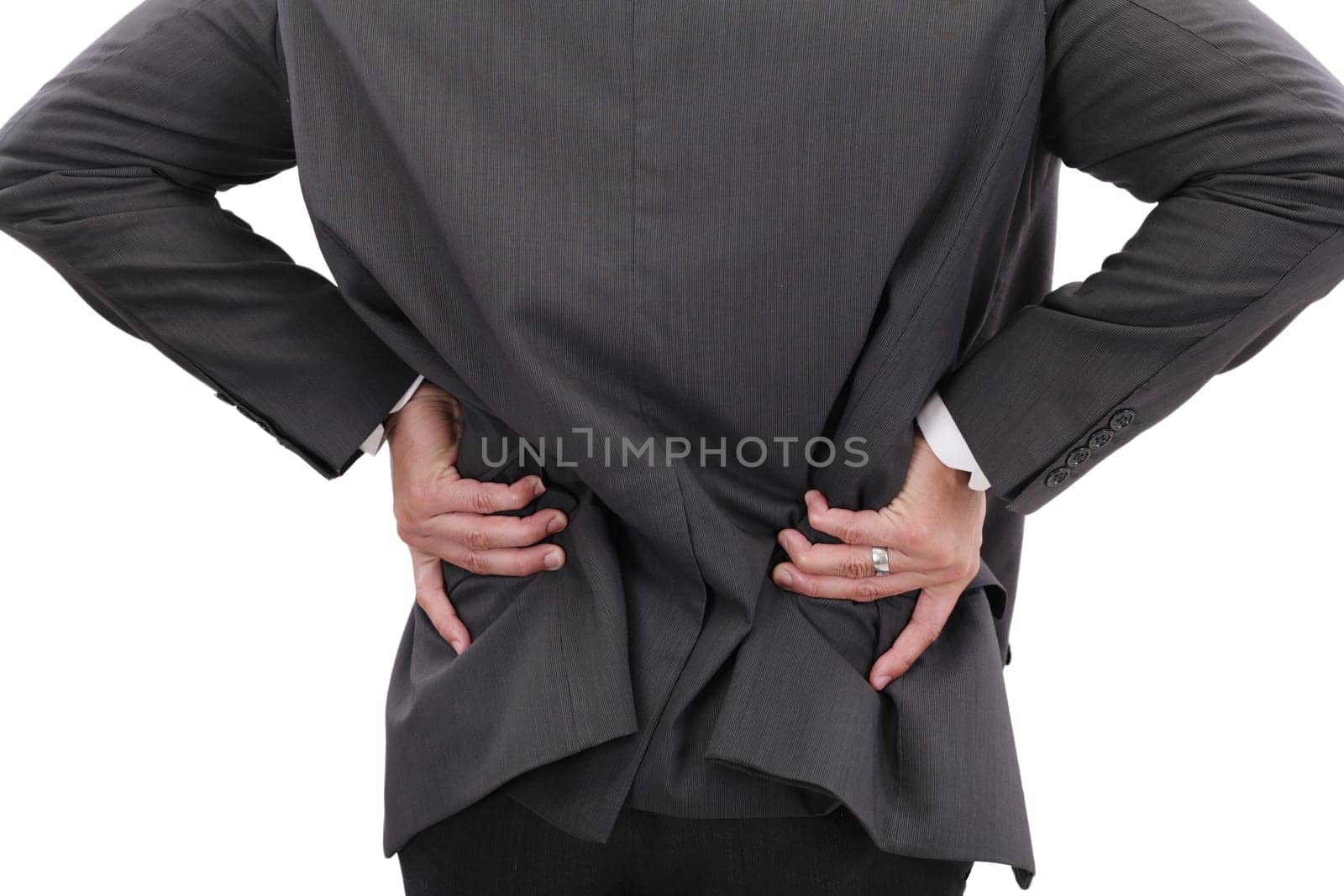 Young businessman having some lower back pain