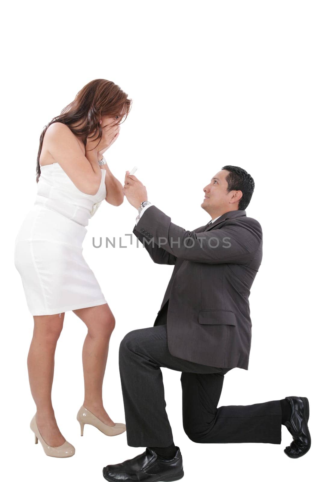 young man down on his knee proposing to girlfriend