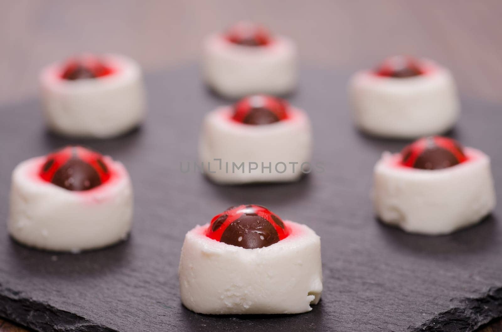 Sugar ladybugs on a cream cheese
