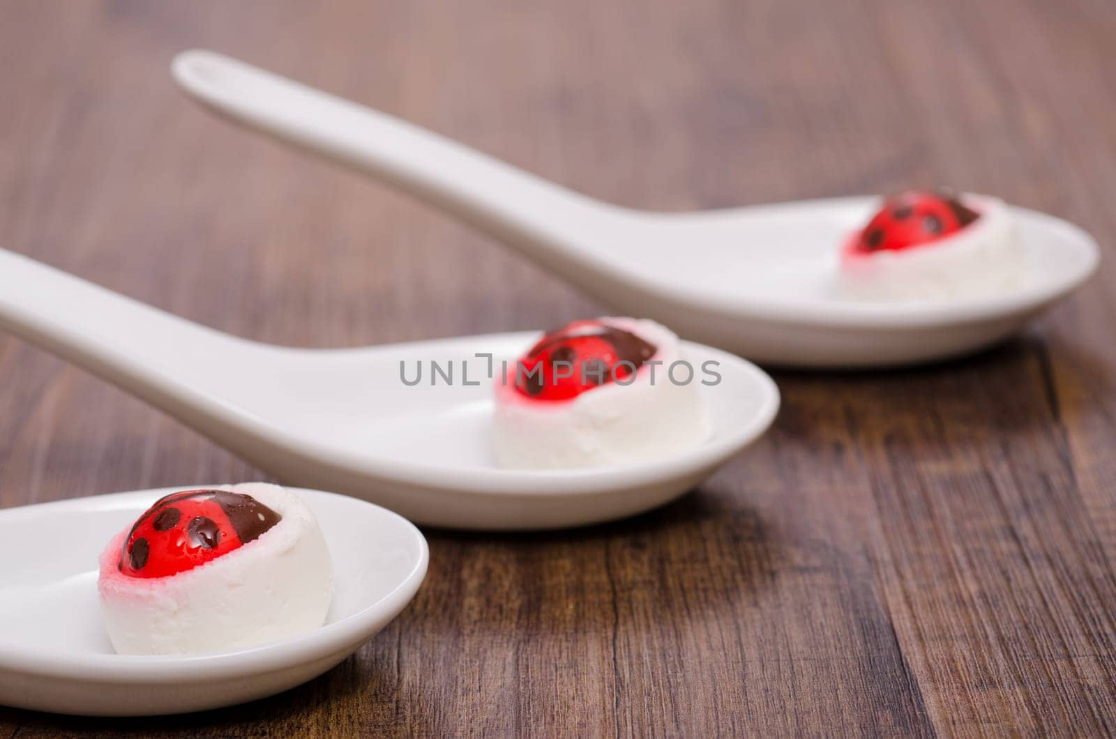 Sugar ladybugs on goat cheese