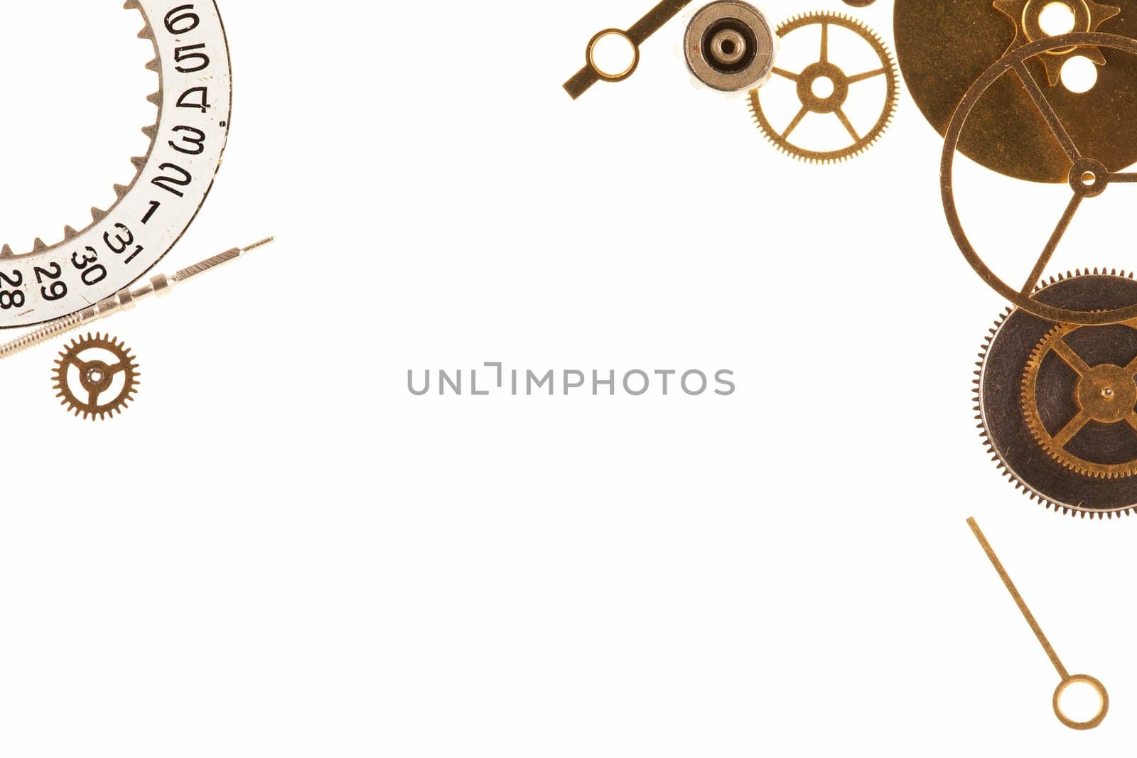 Cogs and other watch parts isolated on white background with copy space.