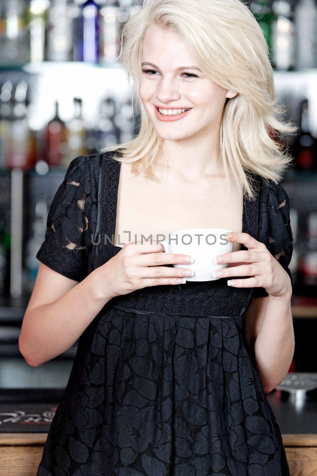 attractive woman waiting for someone at a wine bar.
