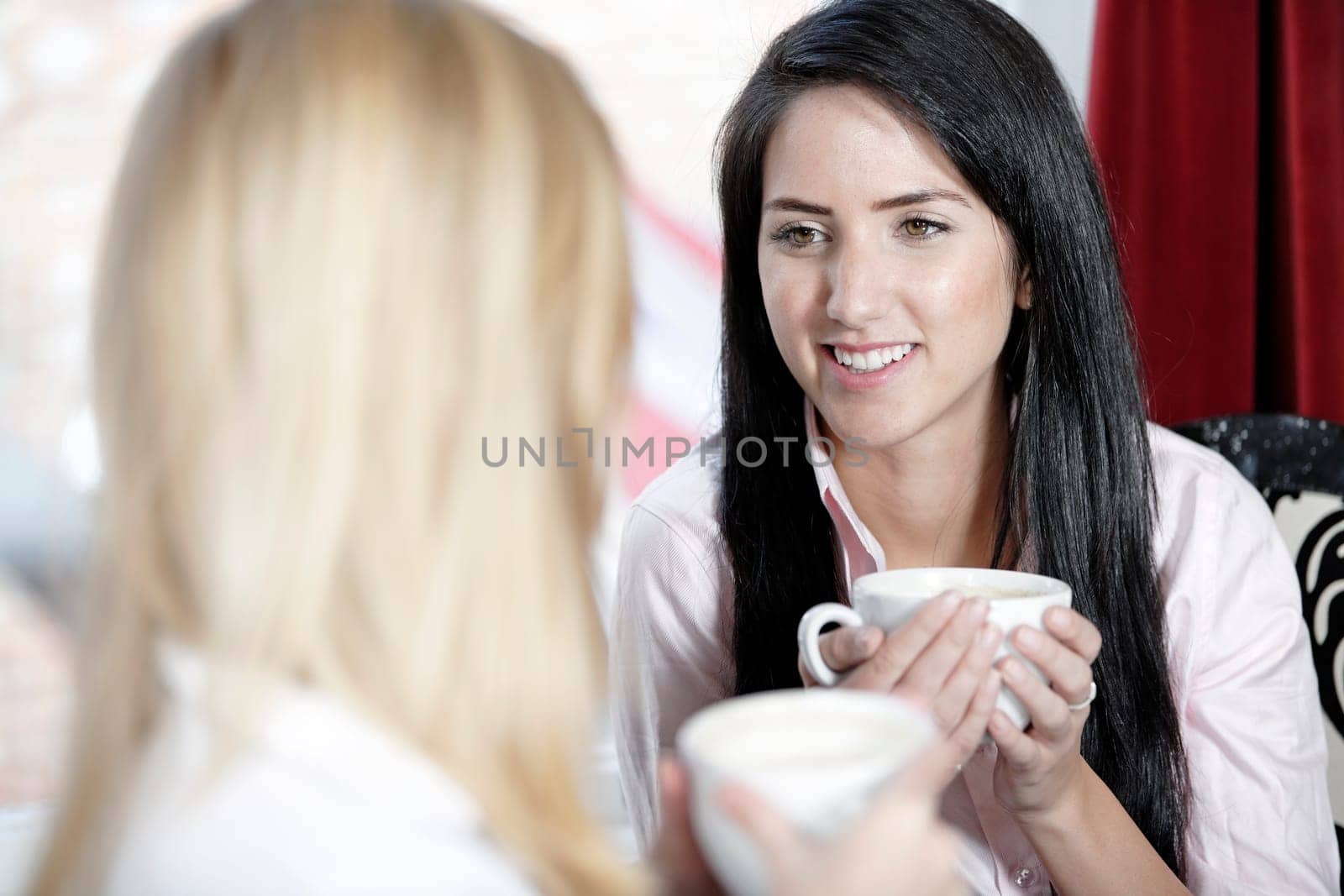 Professional work colleagues meeting up and having a drink.