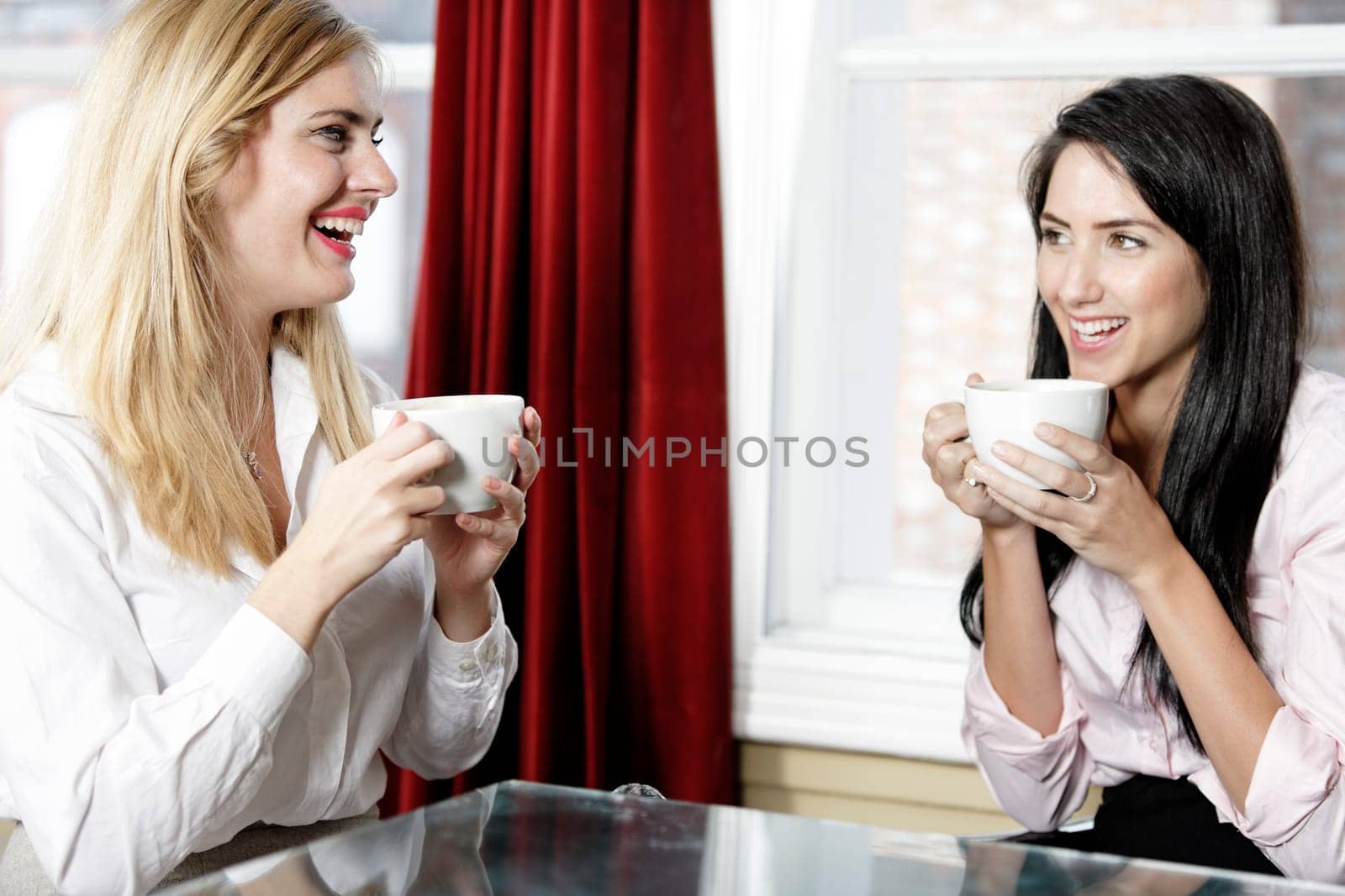 Professional work colleagues meeting up and having a drink.