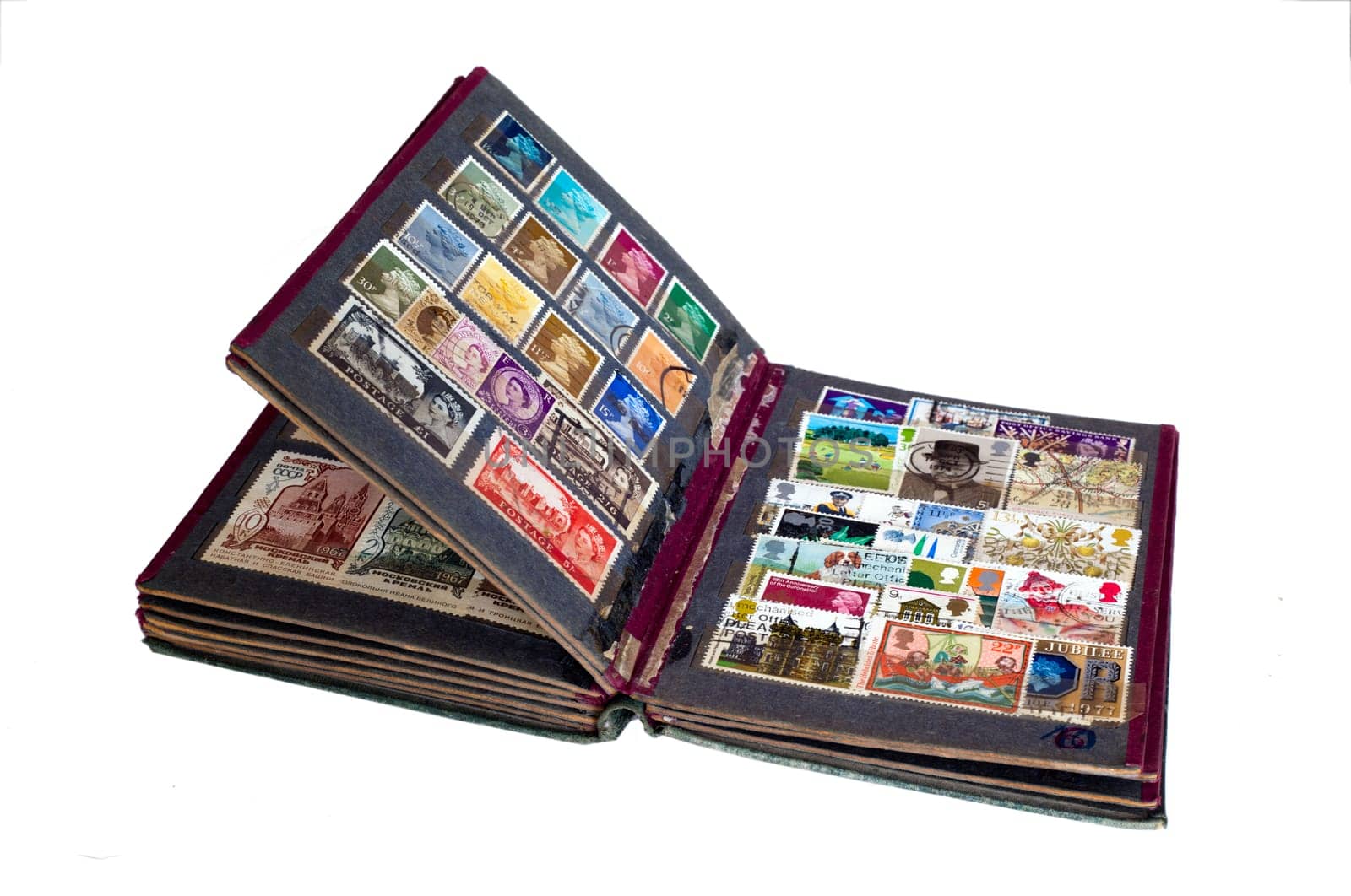 Vintage stamp album with postage stamps isolated on white