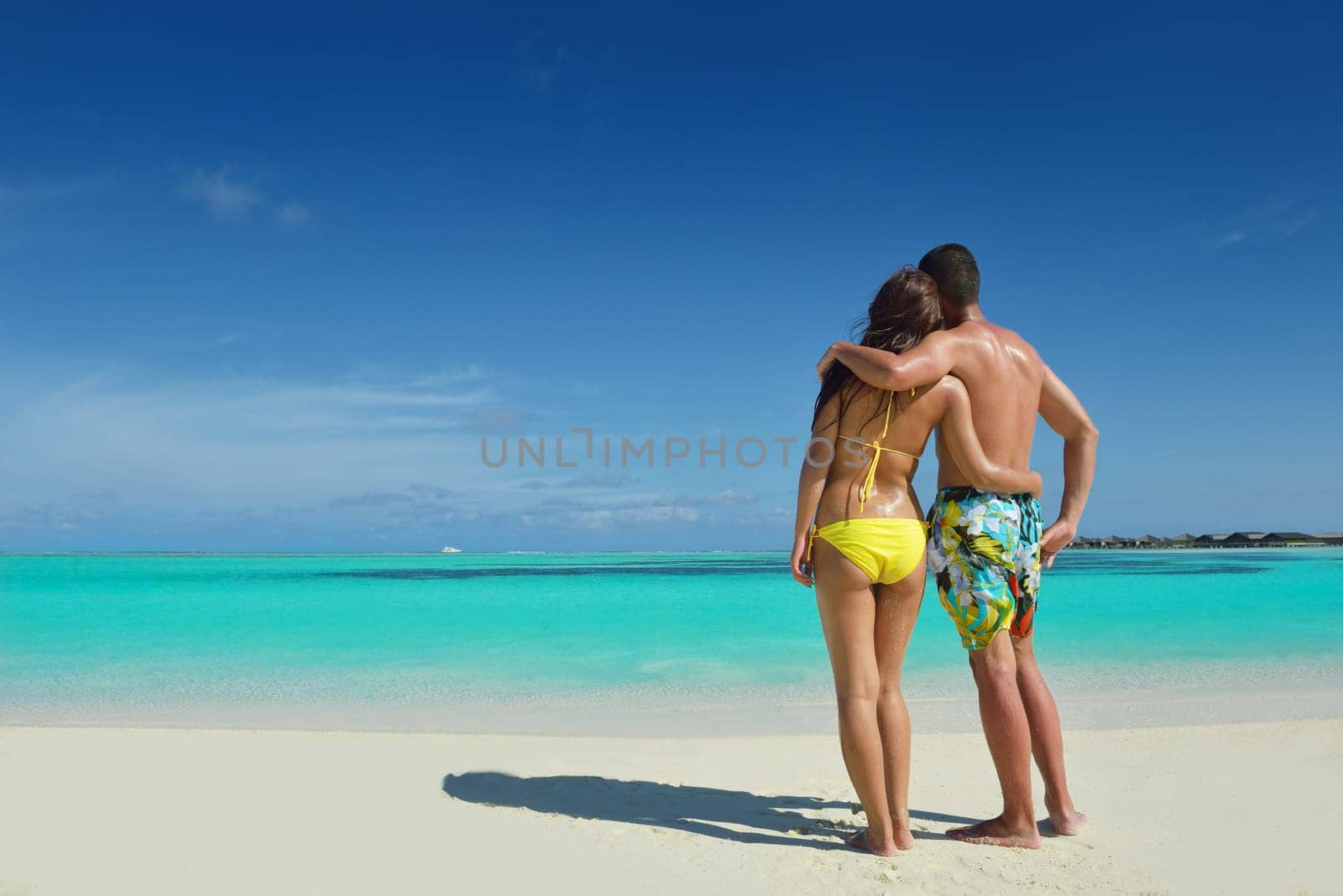 happy young asian couple have fun and romantic time at  summer on beautiful white sand beach