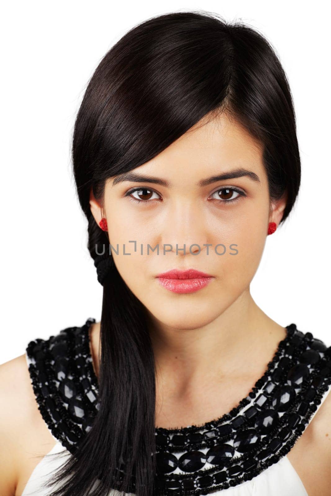 Portrait of a beautiful young woman looking at camera isolated on white.