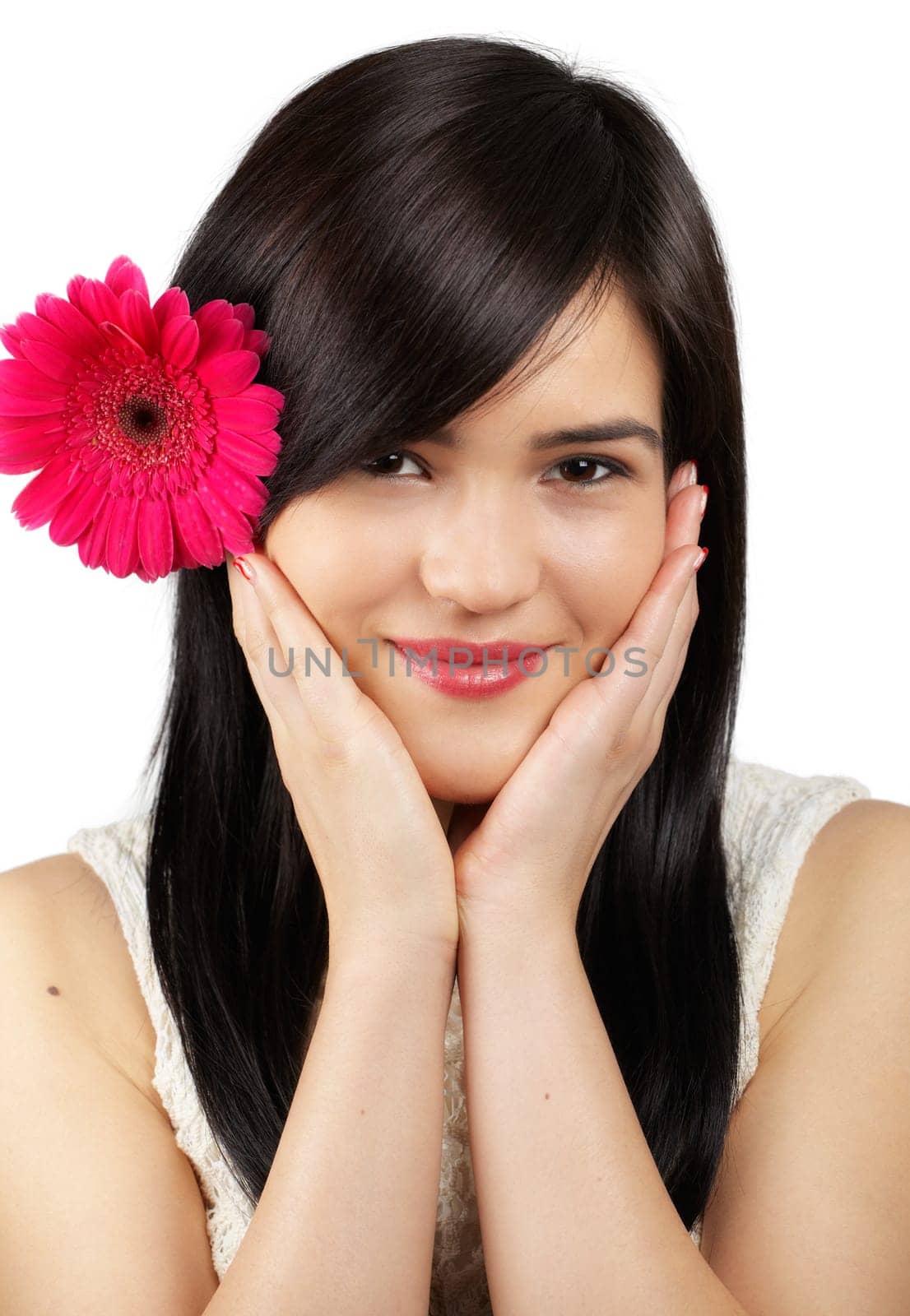 Portrait of a beautiful young woman with a flower in her hair isolated on white.