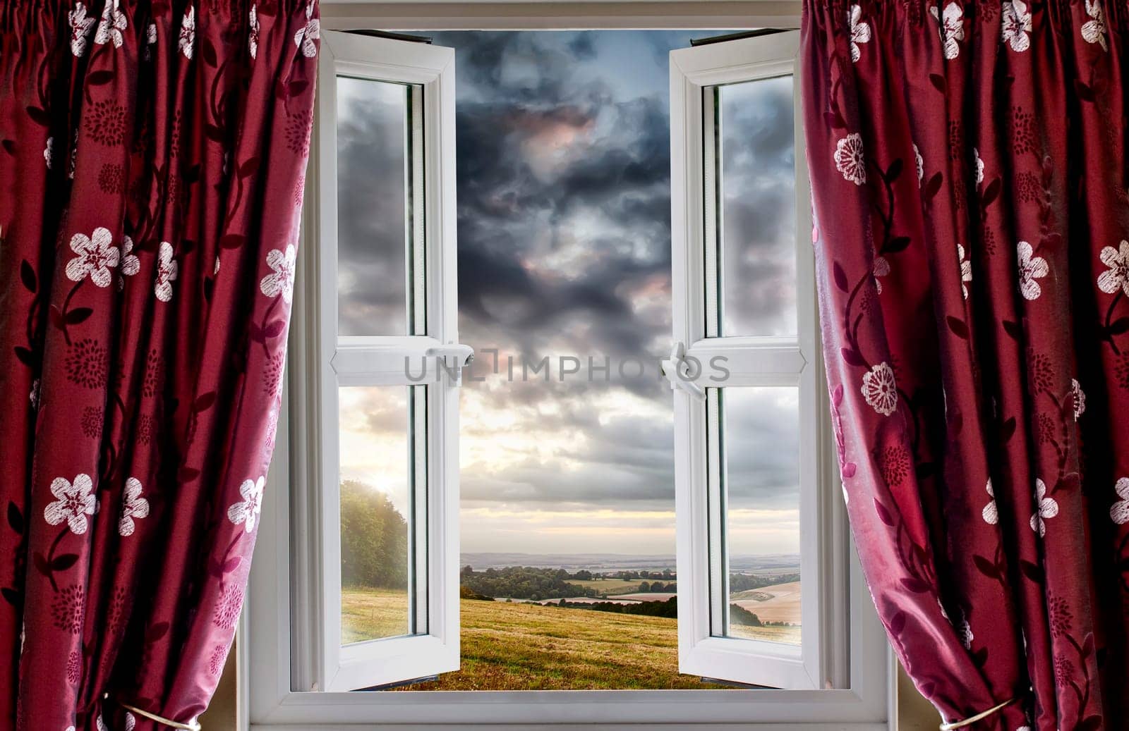 Open window onto landscape fields and clouds