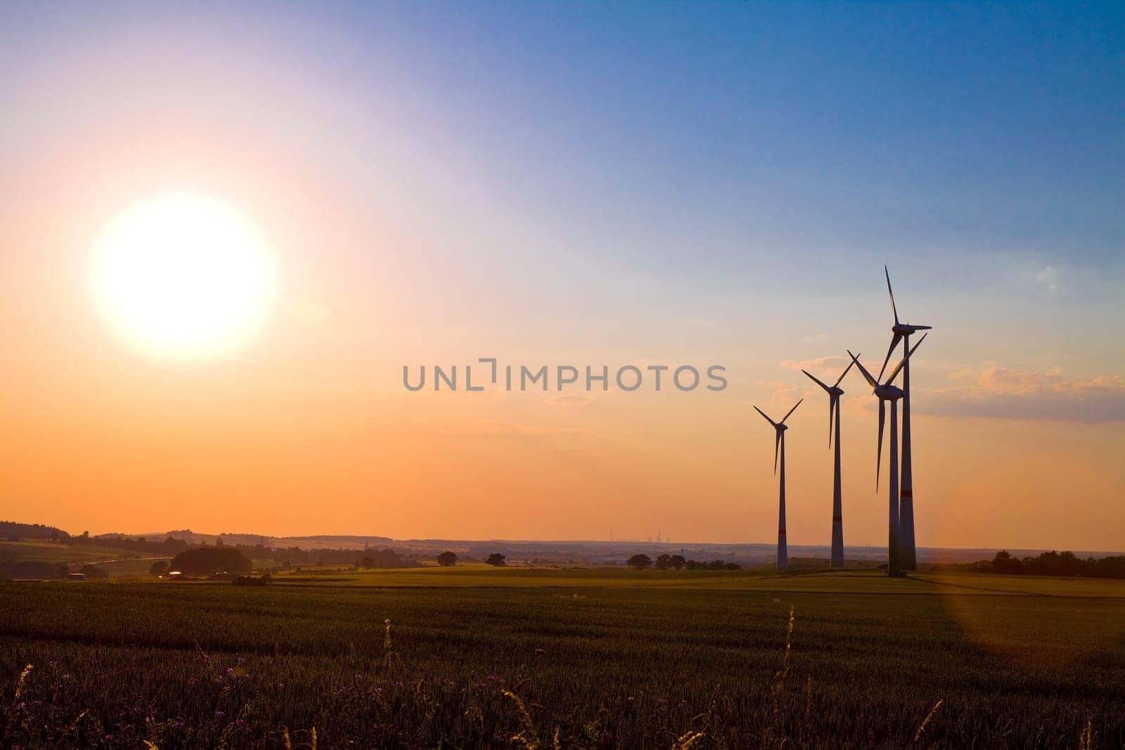 Windmills at sunset, alternative energy source