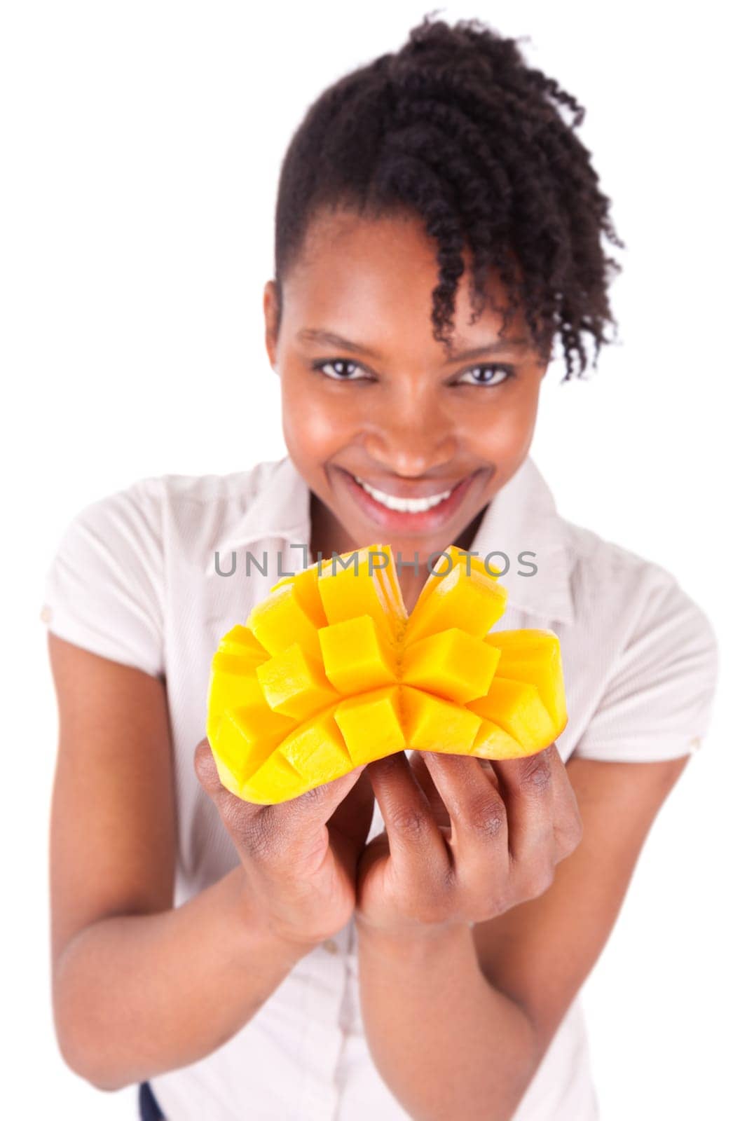 Young happy black / african american woman holding fresh mango isolated on white background