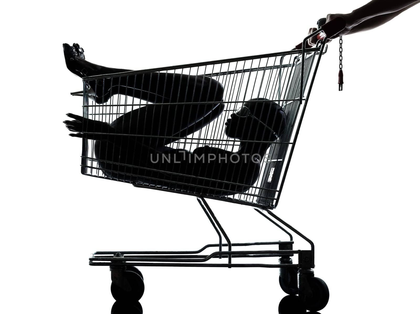 one beautiful black african naked woman sitting inside in a caddy shopping cart in studio isolated on white background
