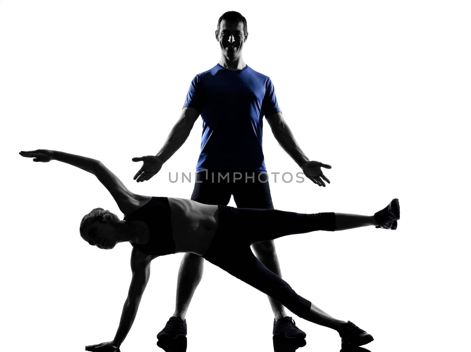couple woman man exercising workout fitness aerobics posture in silhouette studio isolated on white background