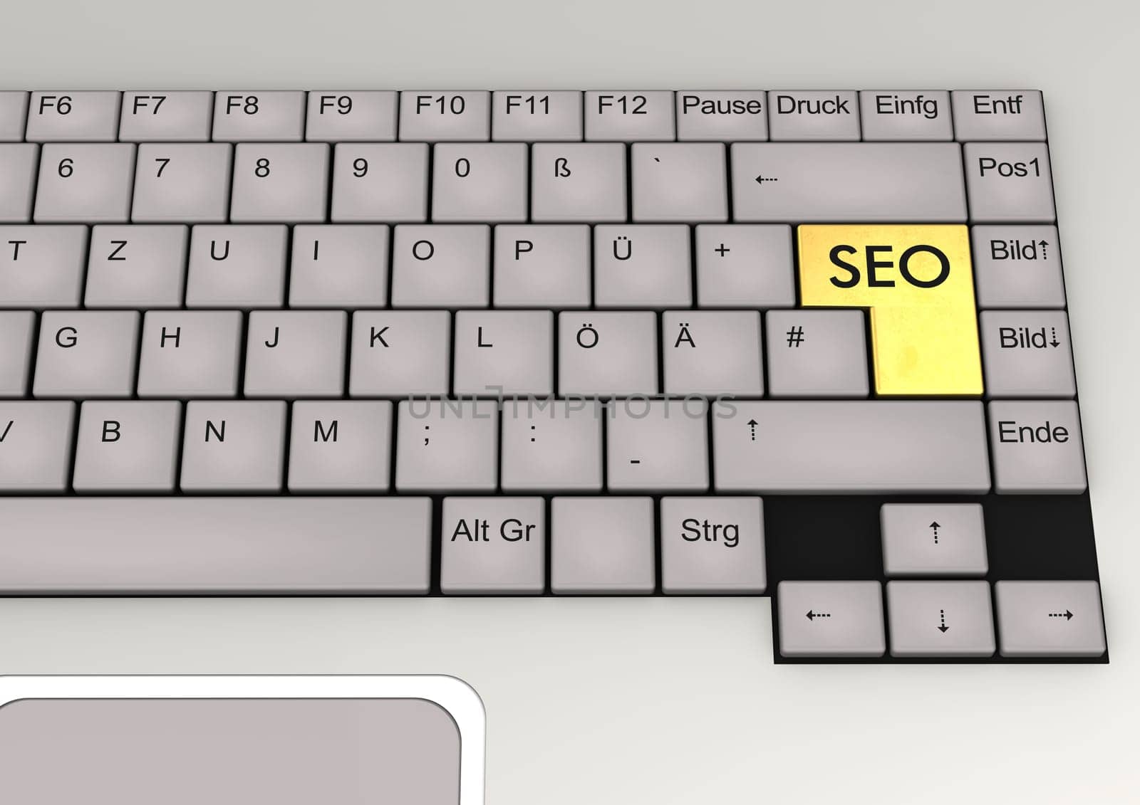 German keyboard of a notebook with golden key SEO.
