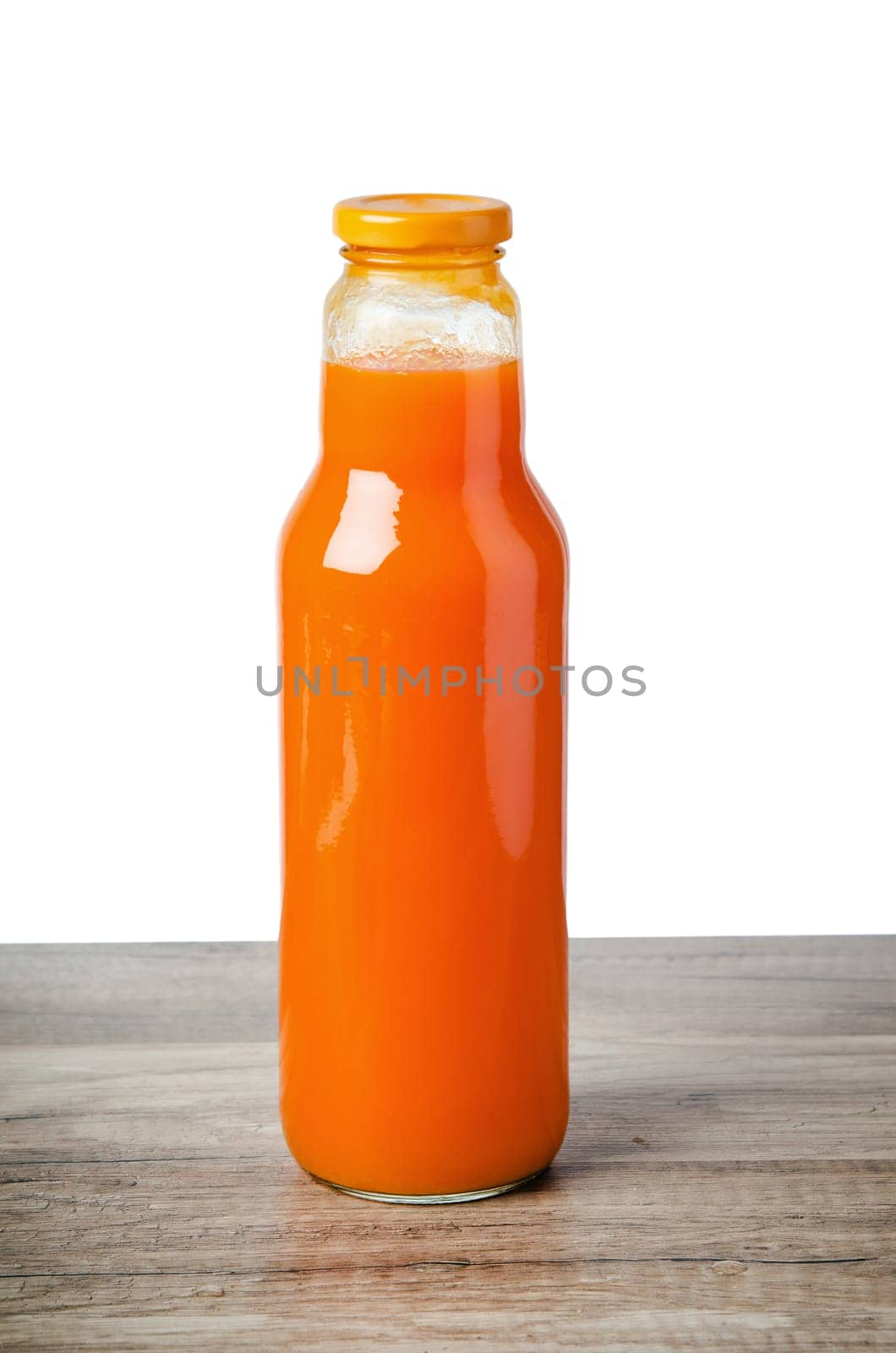 Bottle with carrots juice, it is isolated on white