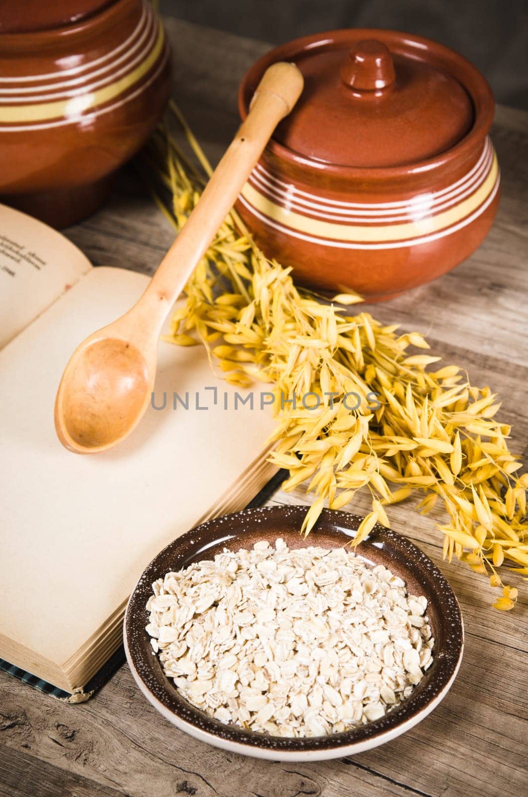 Still life with oatmeal and an open book