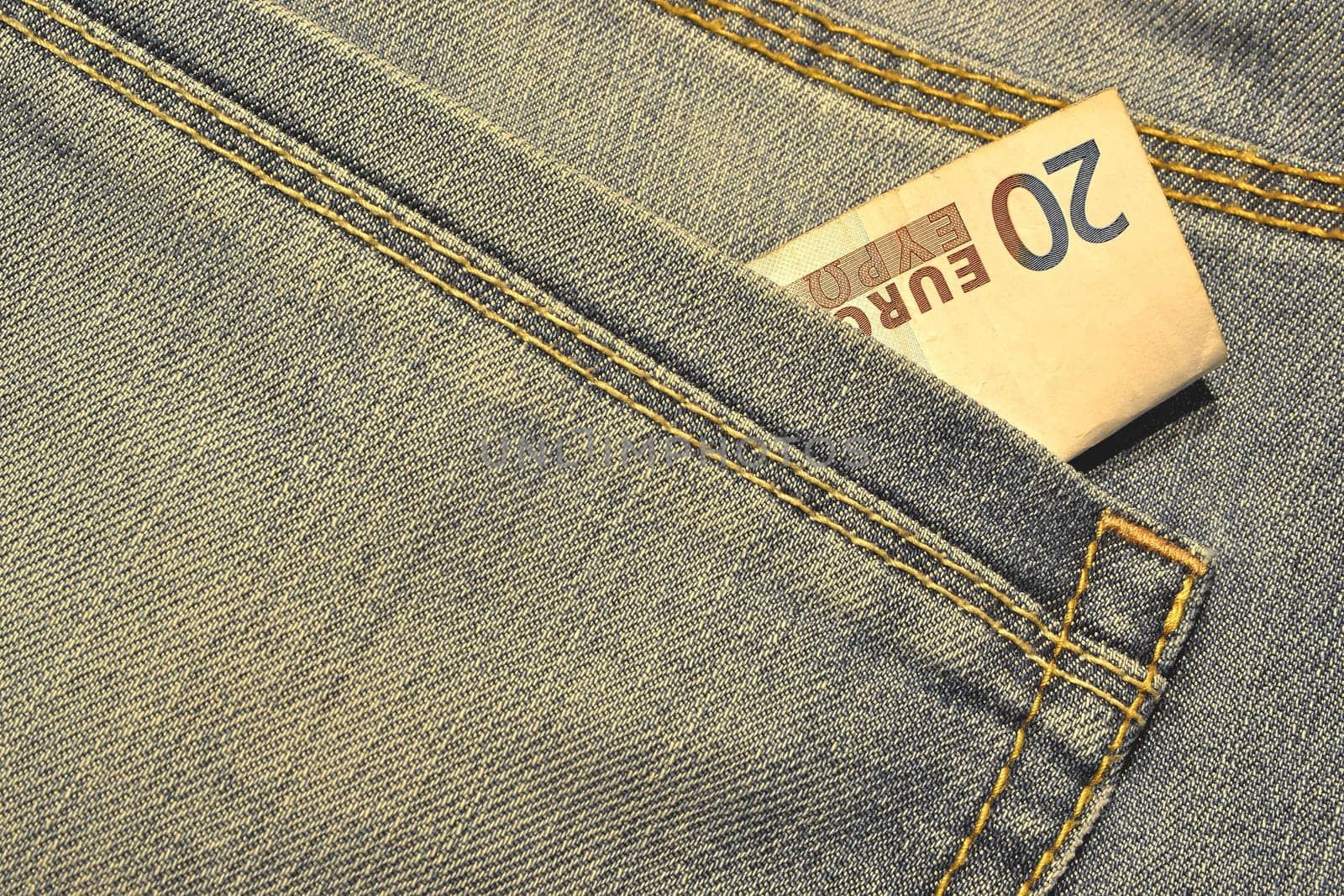 Money in the pocket of a pair of jeans