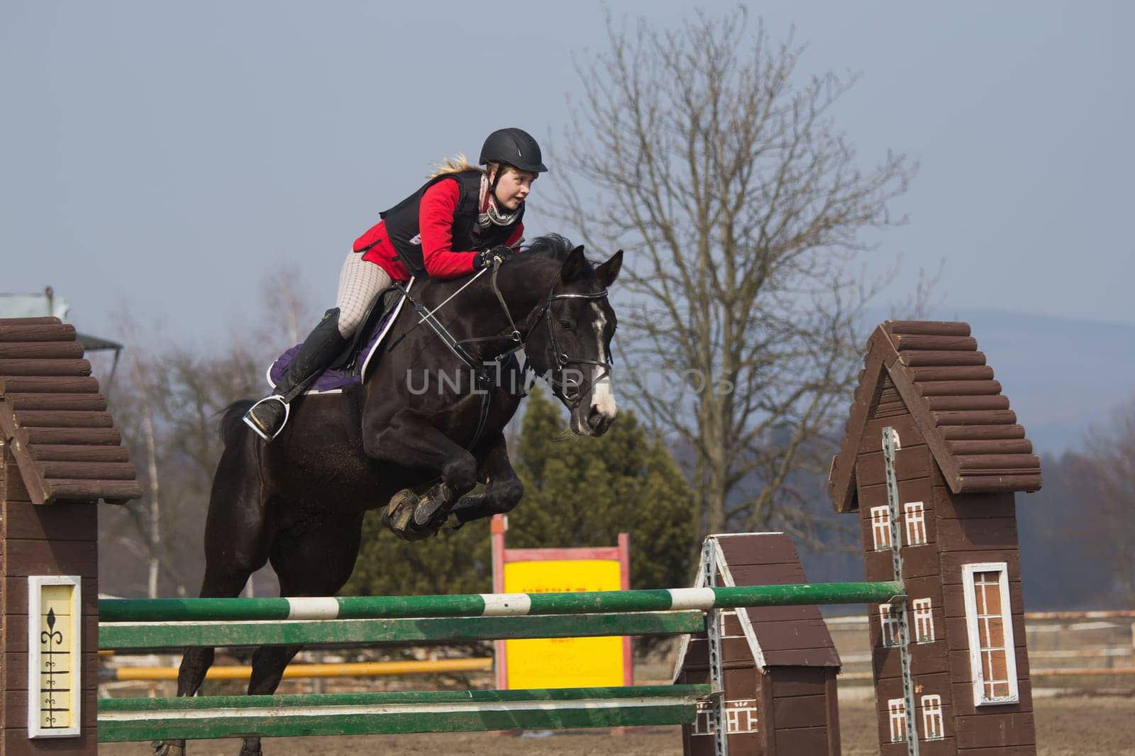 TRESTINA - MAR 30: Jitka Vezelska in action at "The first spring Equestrian Championship"" on March 31, 2013 in Trestina (Czech Republic)"
