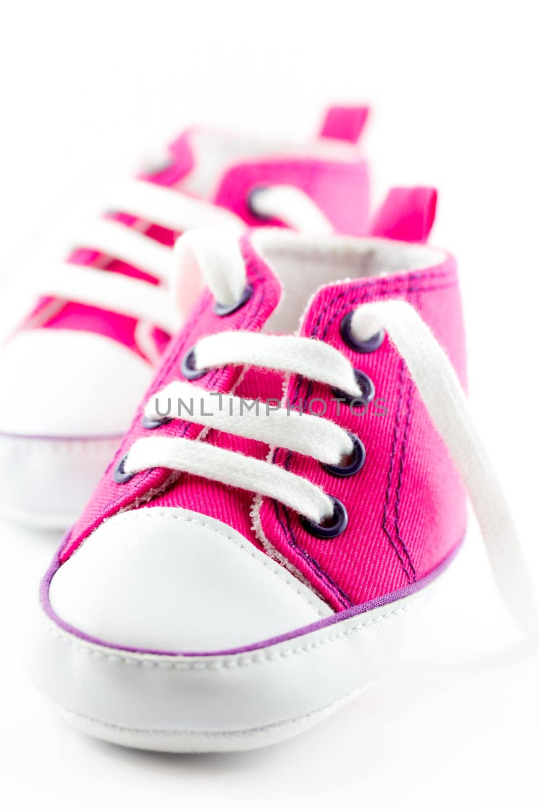 A pair of pink baby sneakers