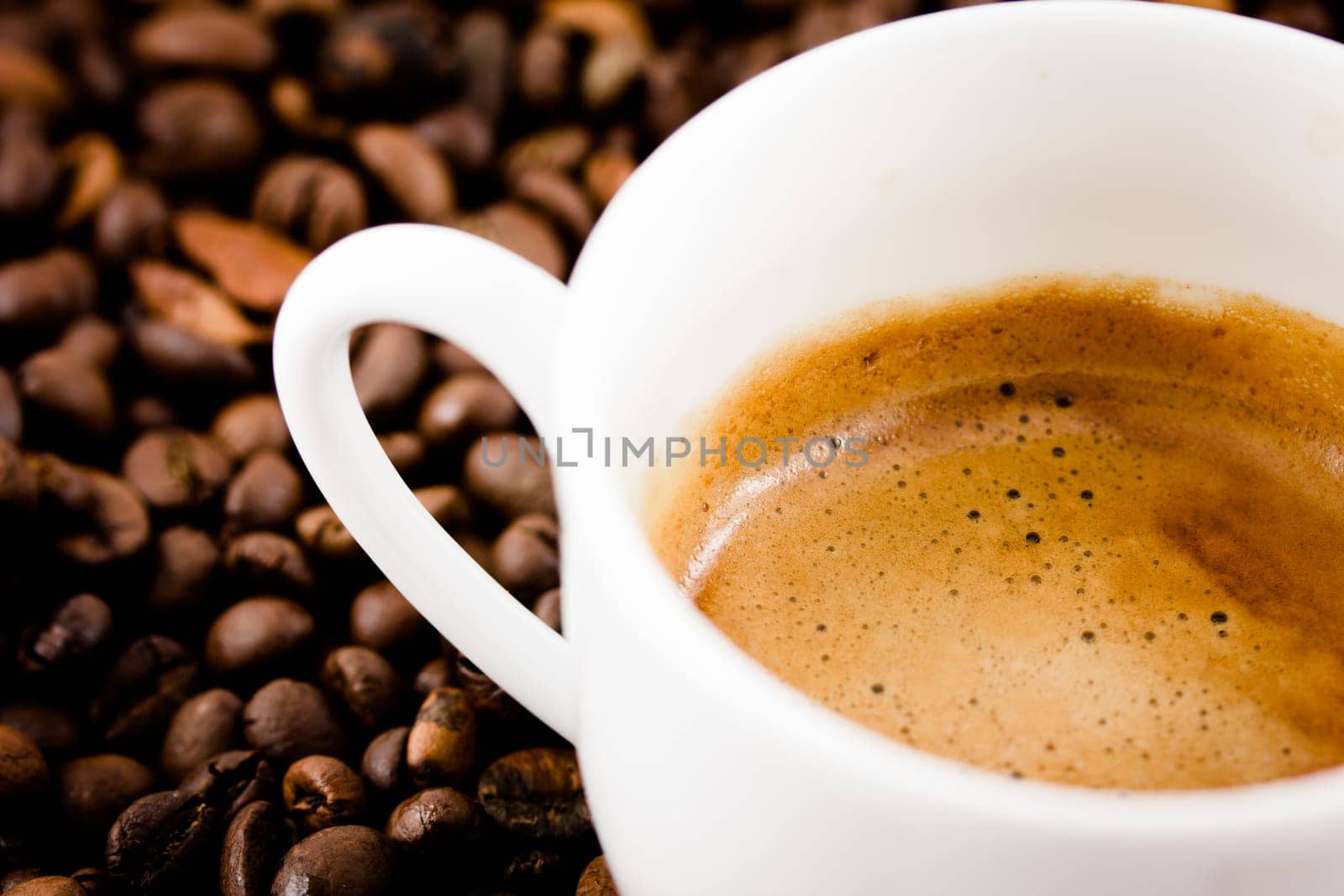 A cup of coffee with beans