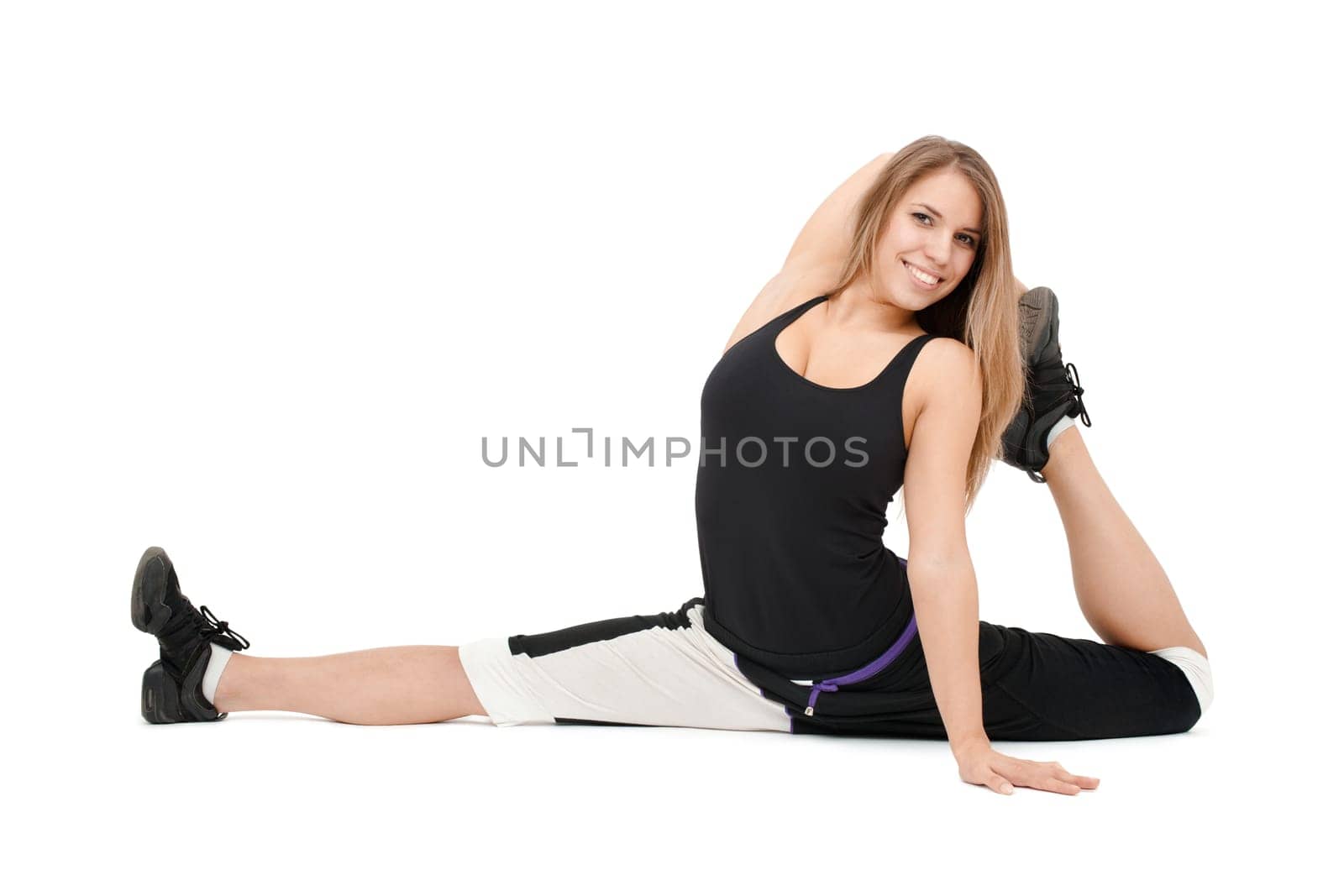 Stretchy woman dancer against white background.