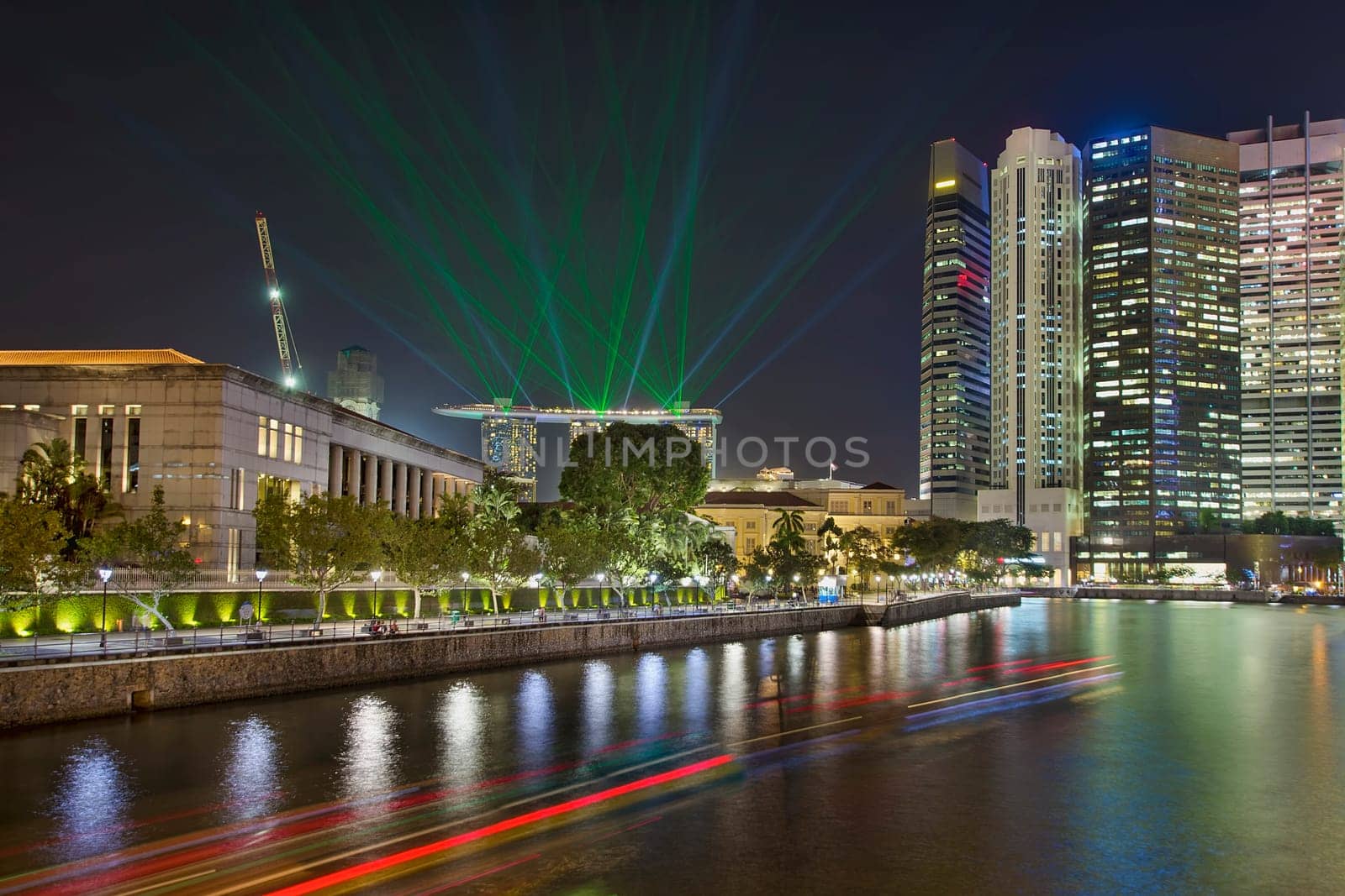 Singapore Central Business District (CBD) City Skyline by Boat Quay Along Singapore River with Laser Light Show at Night