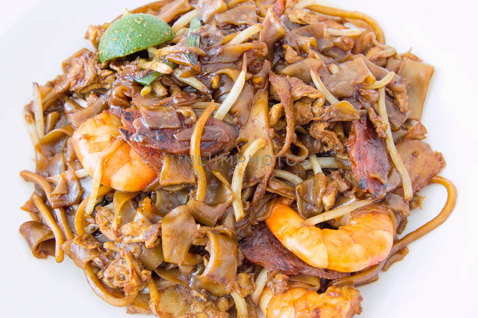 Singapore Char Kway Teow Rice Noodle Stir Fry with Prawns Chinese Sausage and Fishcake Closeup
